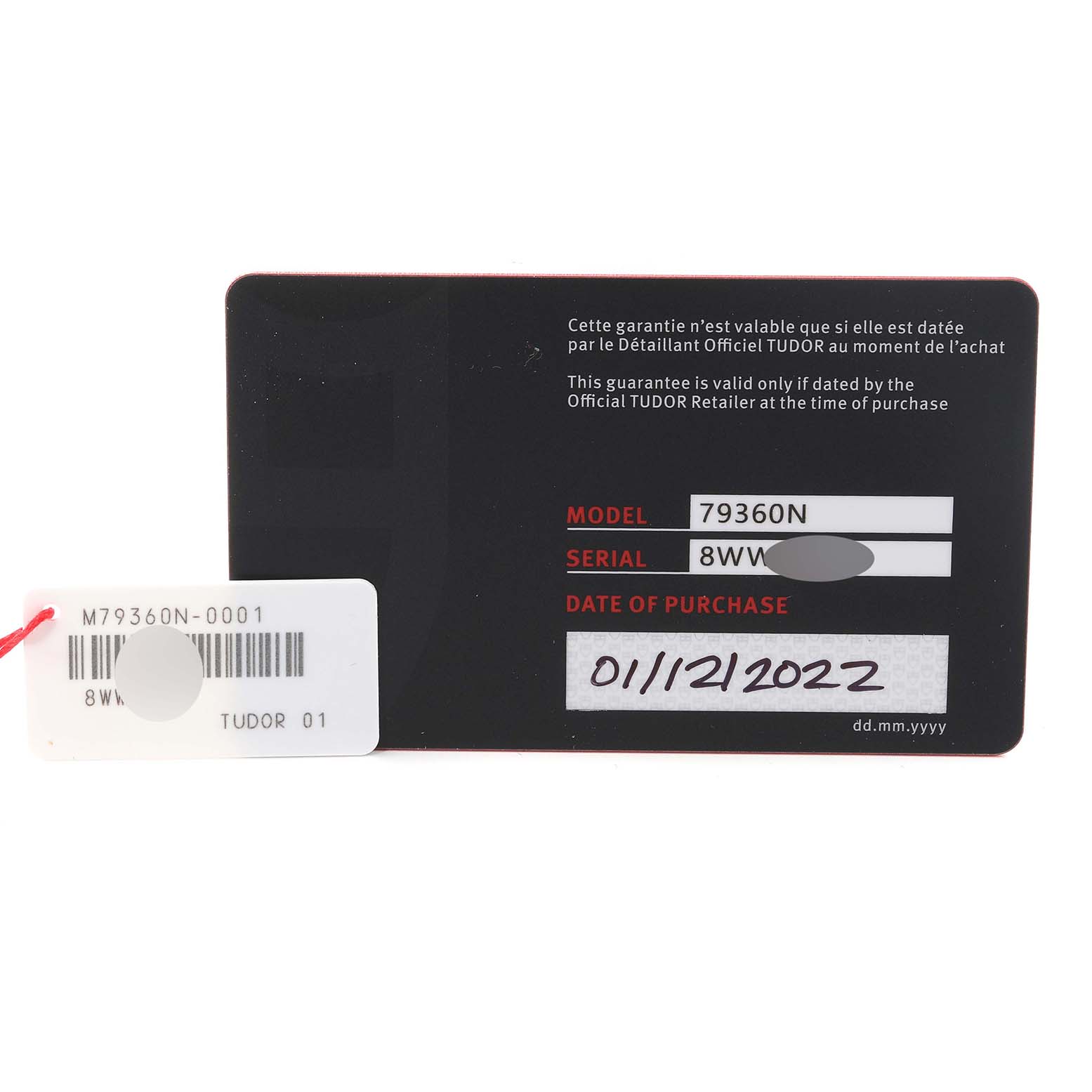 This image shows the warranty card and tag for the Tudor Heritage Black Bay 79360N-0001 Men
s Stainless Steel Black Dial 79360N-0001 Men
s Stainless Steel Black Dial model 79360N.