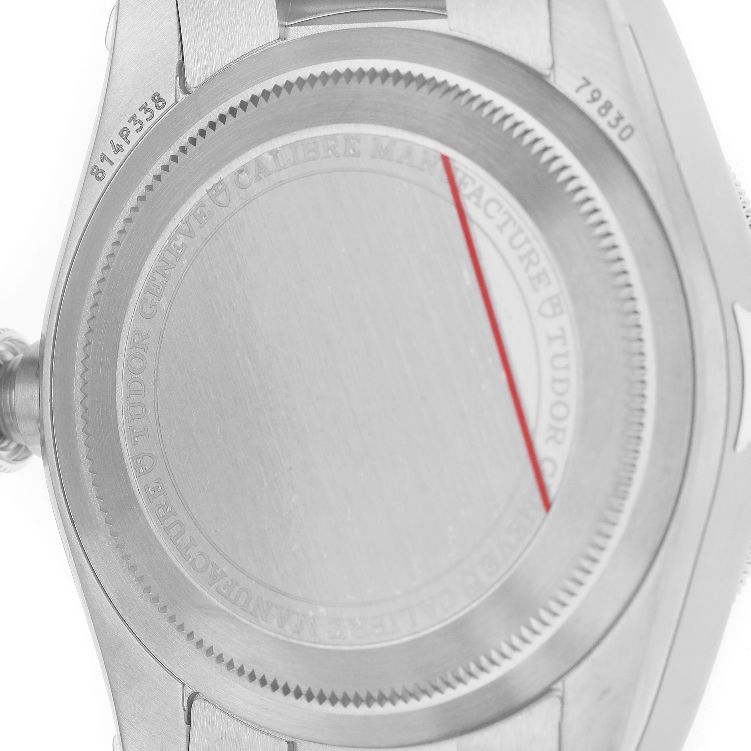 The image shows the back case of the Tudor Heritage Black Bay 79830RB Men's Stainless Steel Silver Dial watch, highlighting its engraved details.