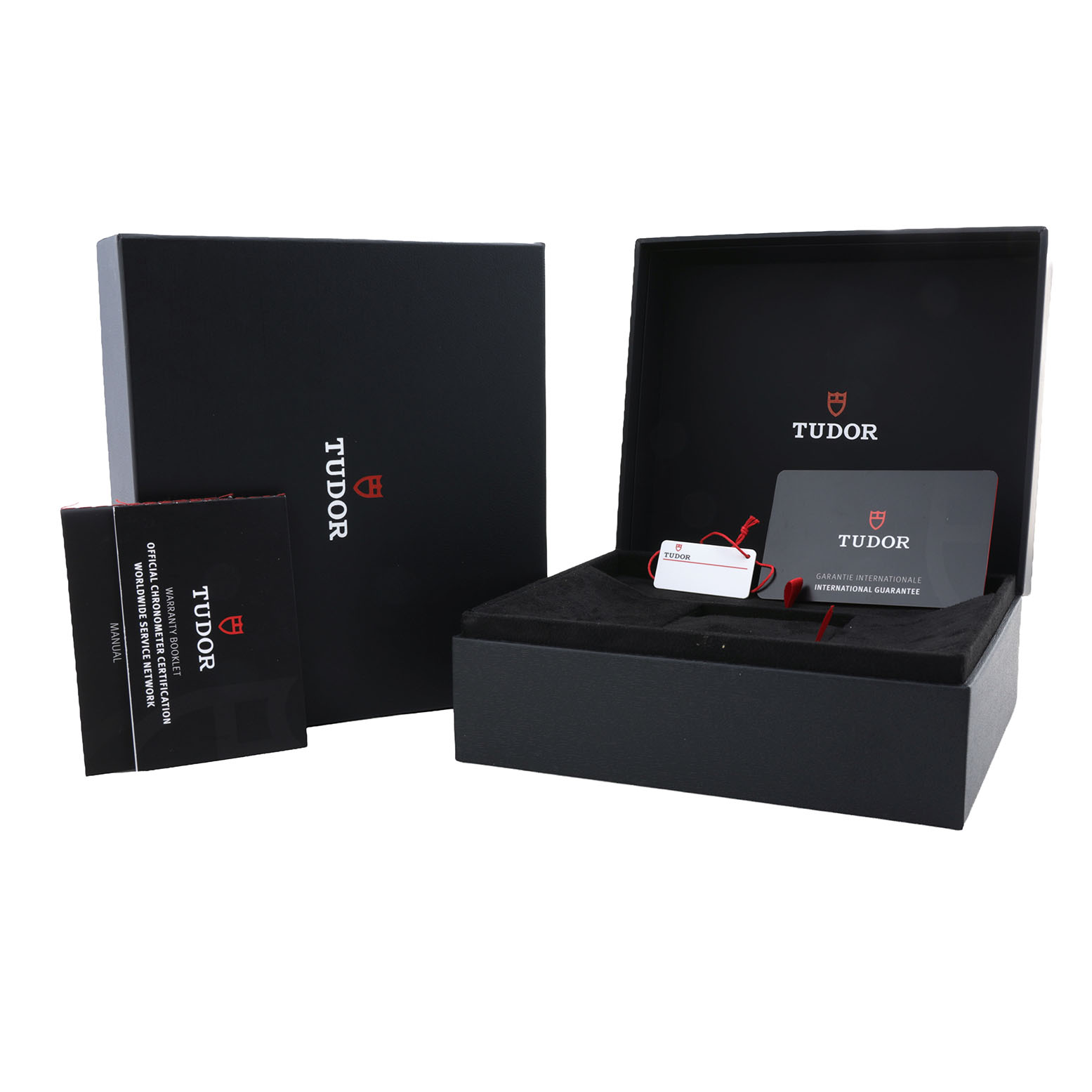 The image shows the Tudor Heritage Black Bay 79830RB Men's Stainless Steel Silver Dial watch's packaging, including a box, an international guarantee card, and a manual.