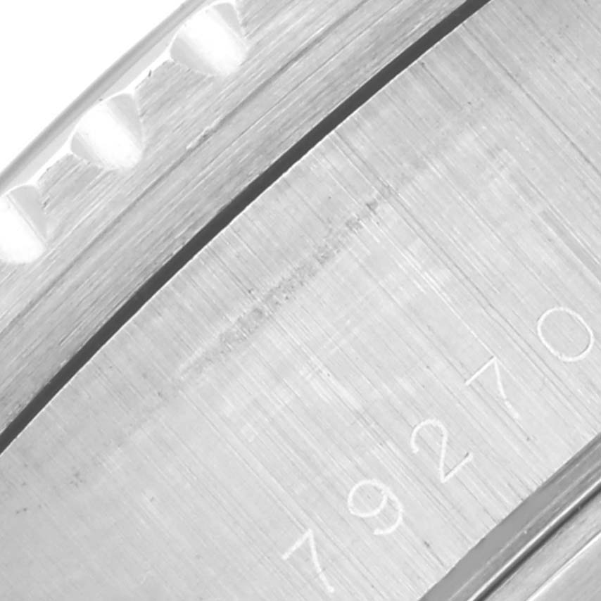 The image shows a close-up of the engraved side of the Tudor Prince 79270 Men
s Stainless Steel Black Dial 79270 Men
s Stainless Steel Black Dial watch case.