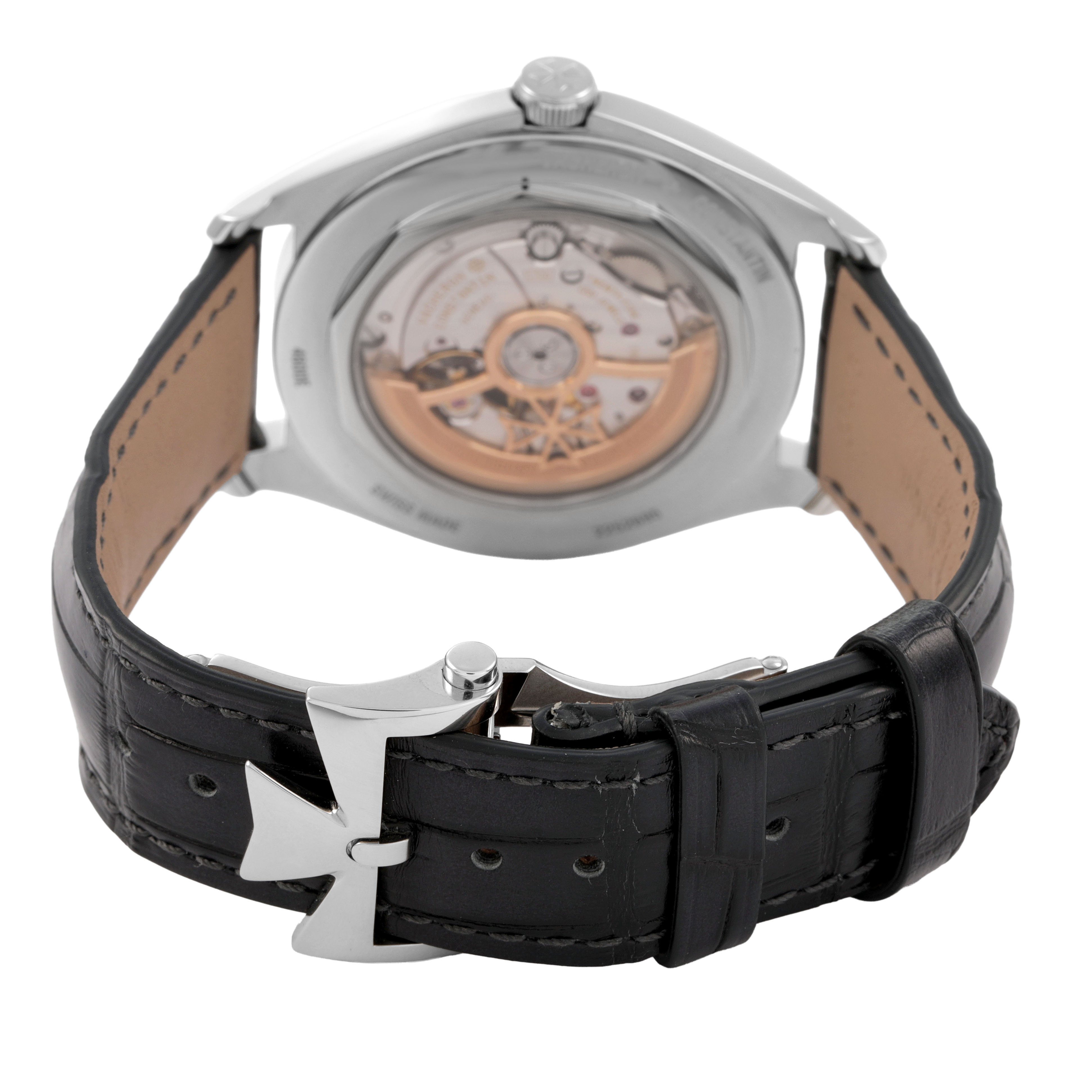 The Vacheron Constantin Fiftysix 4600E/000A-B487 X46A2020 Men's Stainless Steel Silver Dial watch is shown from the back, highlighting the case back and black leather strap with a unique buckle.