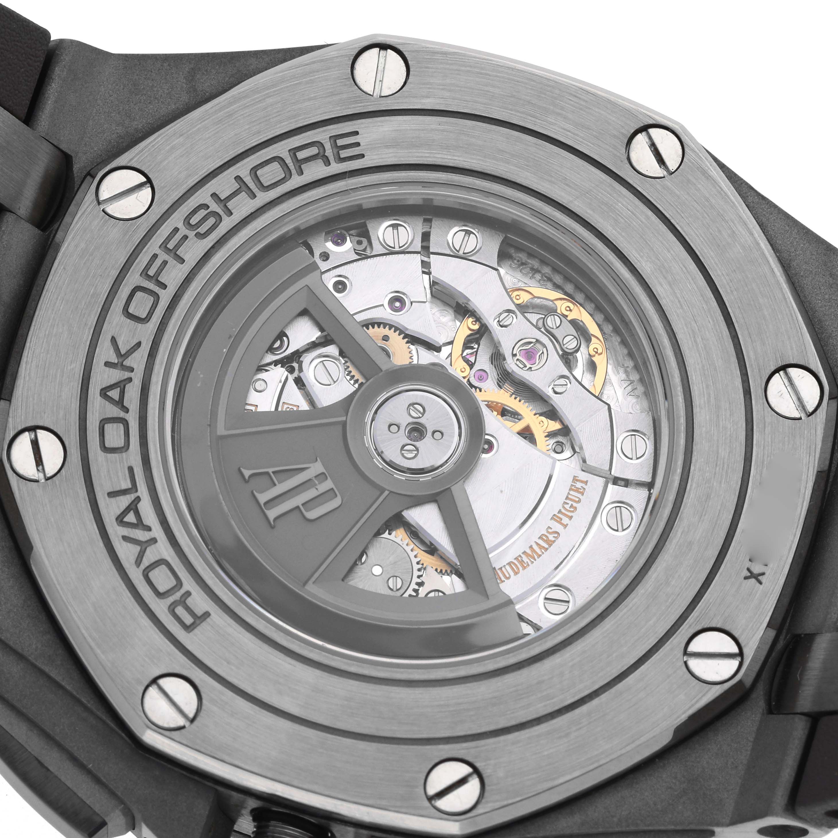 The Audemars Piguet Royal Oak Offshore 26400IO Men's Titanium Grey Dial watch is shown from the back, displaying its open case back and internal mechanisms.