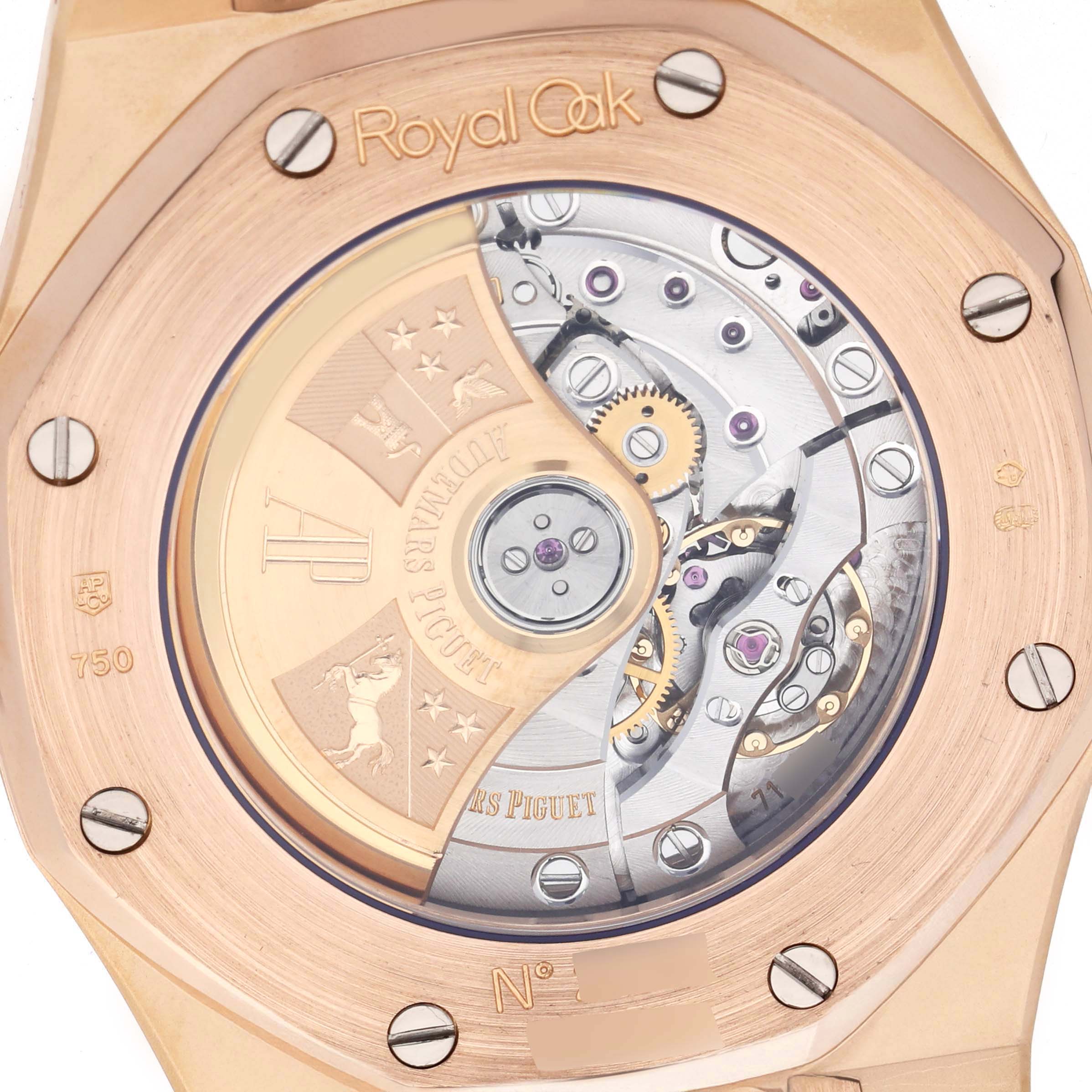 The image shows the back of an Audemars Piguet Royal Oak 15300OR.OO.D088CR.02 Men
s Rose Gold Silver Dial, revealing its intricate movement and rotor design.