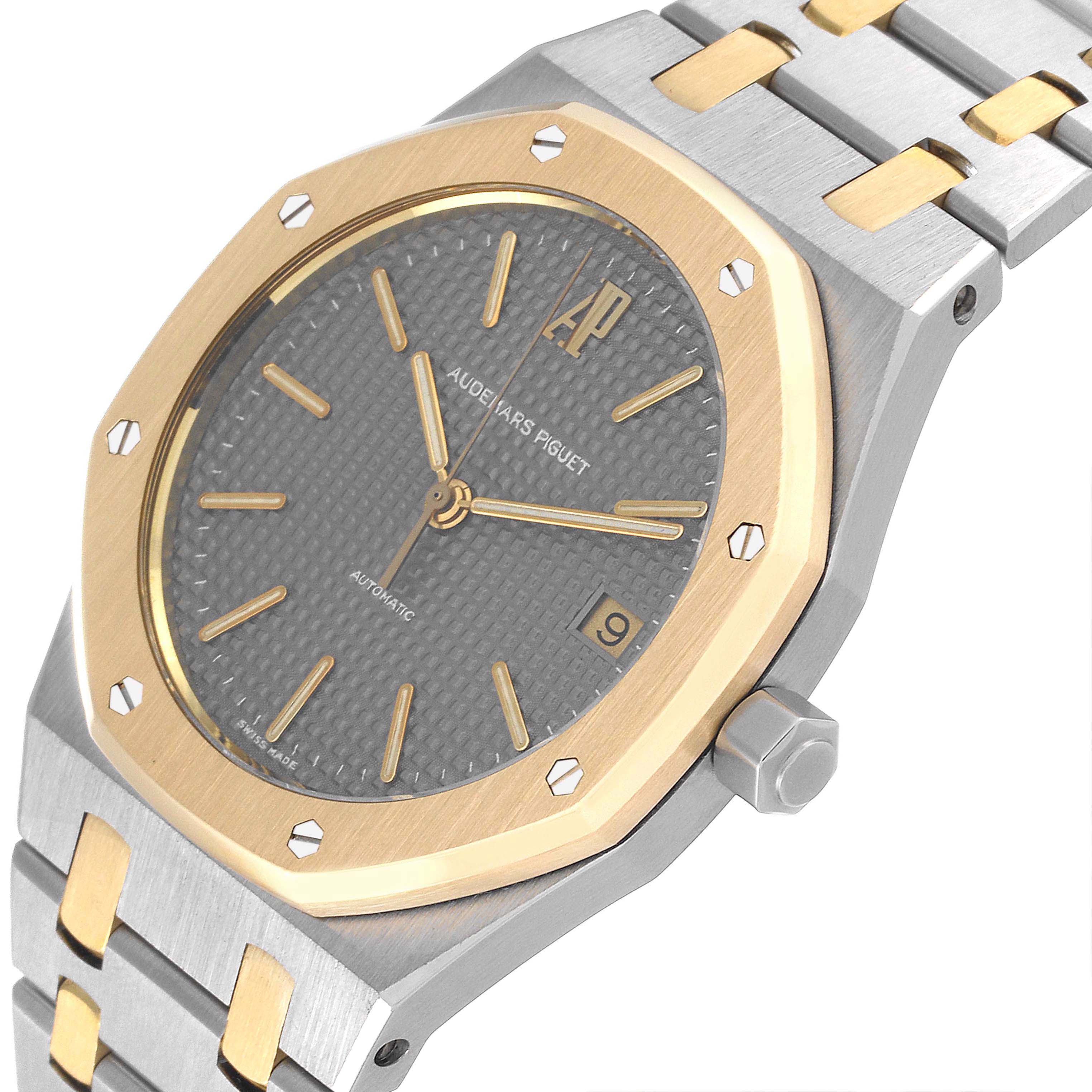 The image shows a close-up of the dial, bezel, and part of the bracelet of the Audemars Piguet Royal Oak 14790SA.OO.0789SA.01 Men
s Steel and Gold (two tone) Grey Dial 14790SA.OO.0789SA.01 Men
s Steel and Gold (two tone) Grey Dial watch.