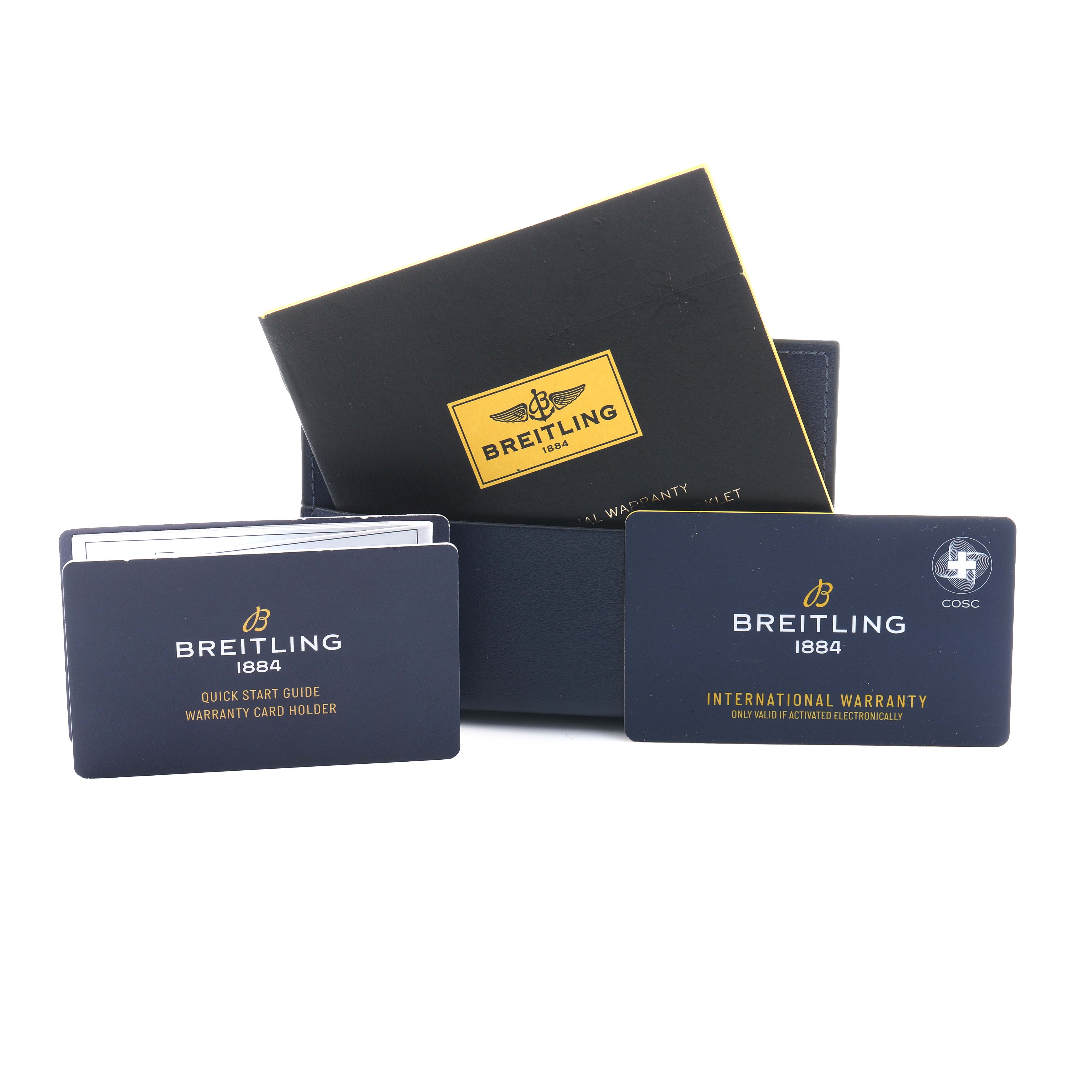 The image shows Breitling Avenger A17319 Men
s Stainless Steel Yellow Dial accessories including a quick start guide, warranty card holder, and international warranty card.