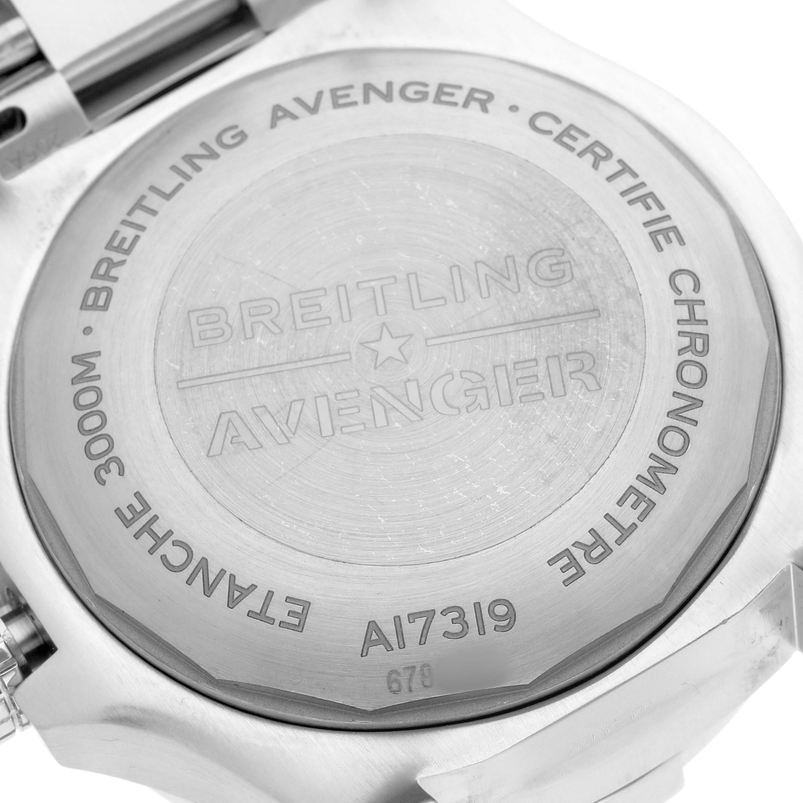 The image shows the case back of the Breitling Avenger A17319 Men
s Stainless Steel Yellow Dial watch, featuring engraved details and model information.