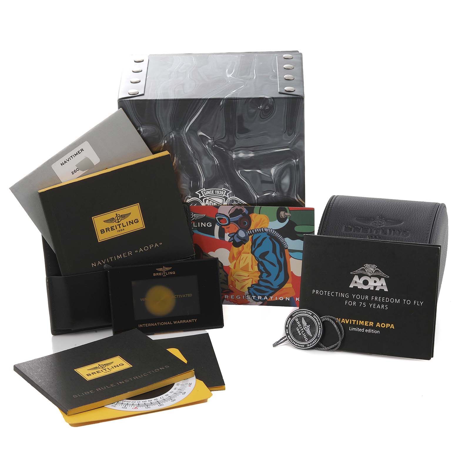 The image shows various accessories and packaging for the Breitling Navitimer A23322 Men's Stainless Steel Black Dial A23322 Men's Stainless Steel Black Dial model, including boxes, booklets, and tags.