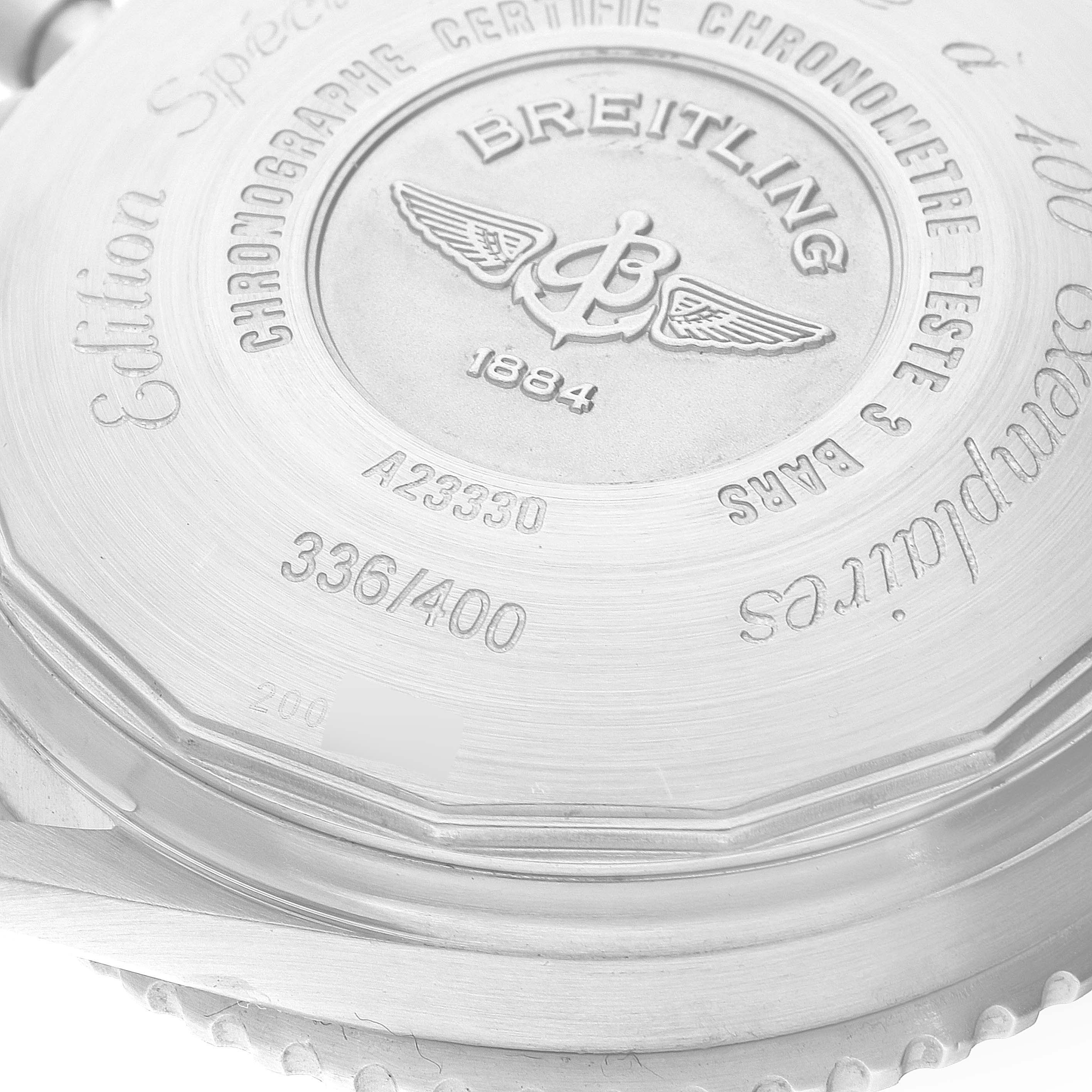 This image shows the back case of a Breitling Navitimer A23330 Men
s Stainless Steel Silver Dial A23330 Men
s Stainless Steel Silver Dial watch, highlighting engraved detailing and model information.