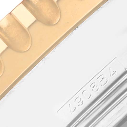 The image shows a close-up of the Breitling Navitimer D23322 Men
s Stainless Steel Black Dial D23322 Men
s Stainless Steel Black Dial
s bracelet and part of the case with a visible serial number.