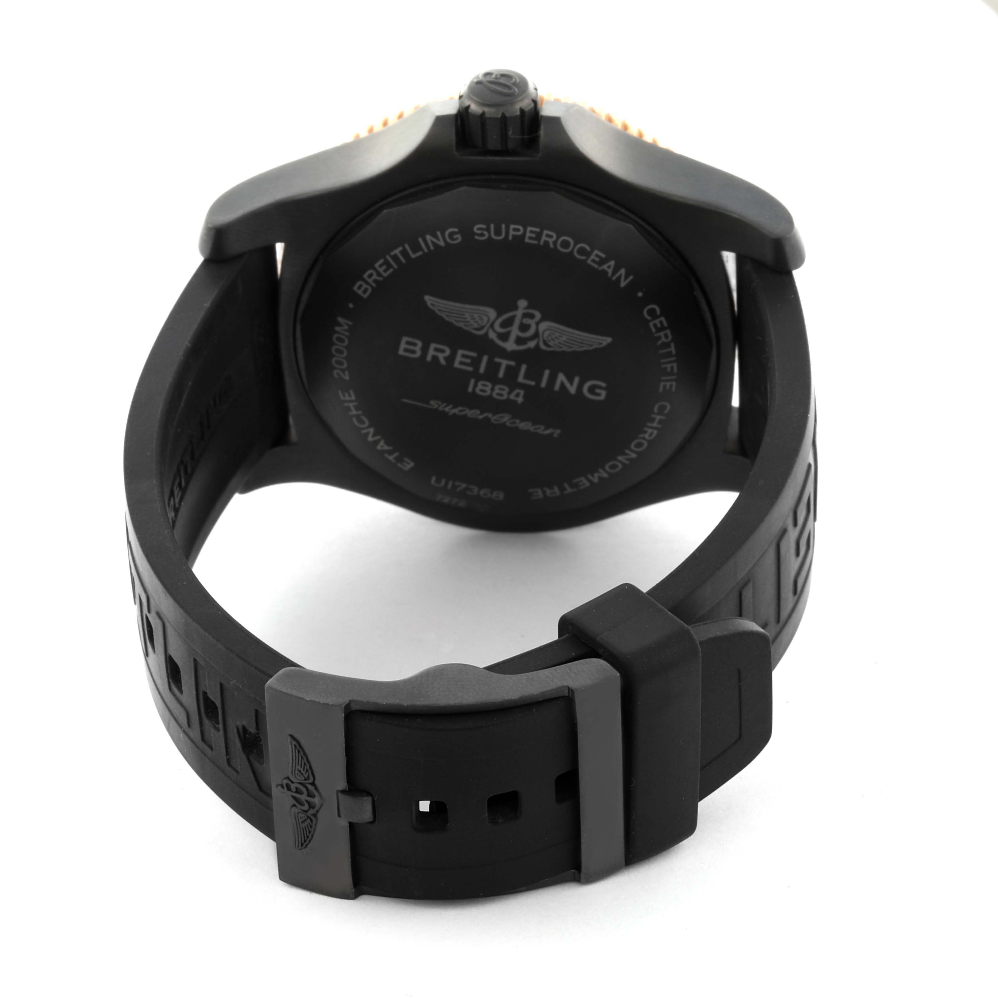 The image shows the back view of a Breitling Superocean U17368 Men's Steel and Gold (two tone) Black Dial U17368 Men's Steel and Gold (two tone) Black Dial watch, highlighting the case back and rubber strap with a buckle.
