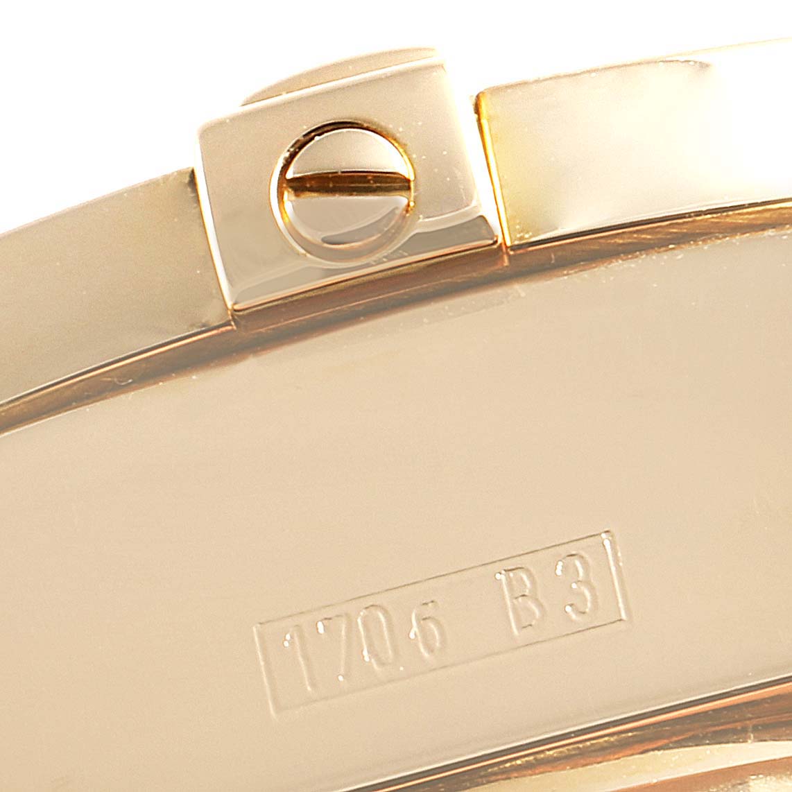 The image shows a close-up of the clasp and part of the metal band of a Breitling Windrider K13358 Men's Yellow Gold Mother of Pearl Dial K13358 Men's Yellow Gold Mother of Pearl Dial watch.