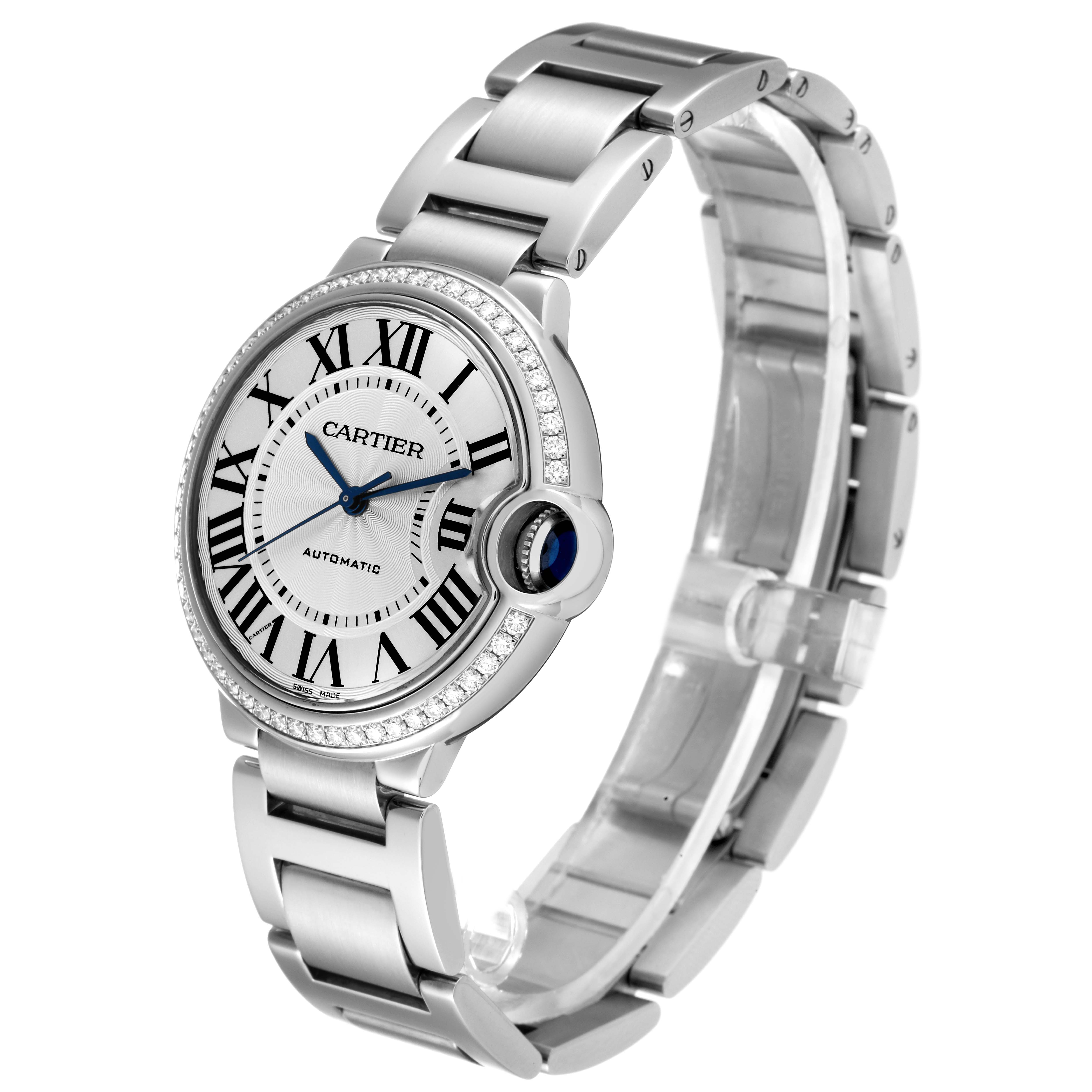 The image shows a Ballon Bleu Cartier watch angled to display the face, bezel, crown, and bracelet.