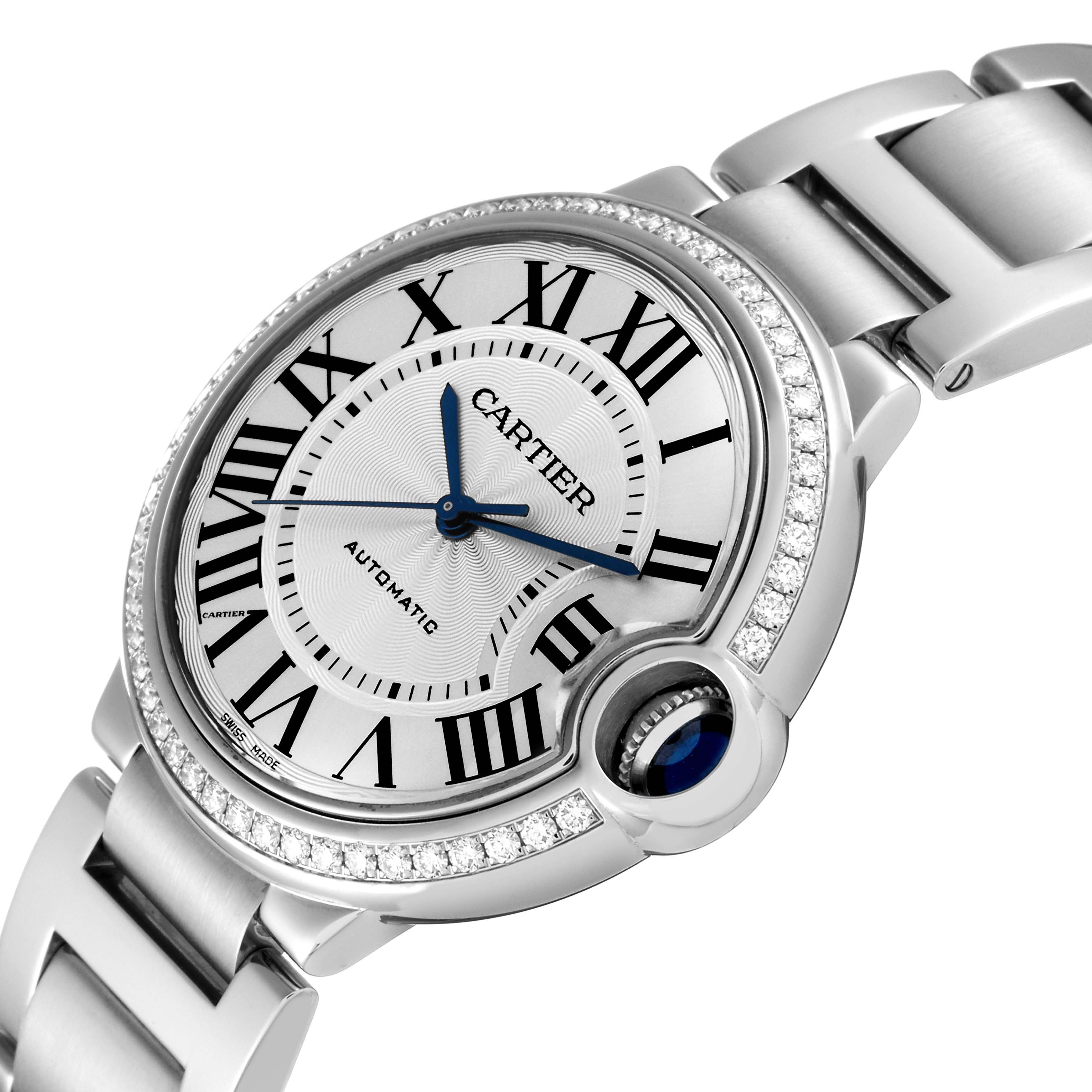The image shows a close-up angle of the Cartier Ballon Bleu W4BB0017 Men
s Stainless Steel Silver Dial W4BB0017 Men
s Stainless Steel Silver Dial watch, highlighting its Roman numeral dial, blue hands, and diamond-set bezel.