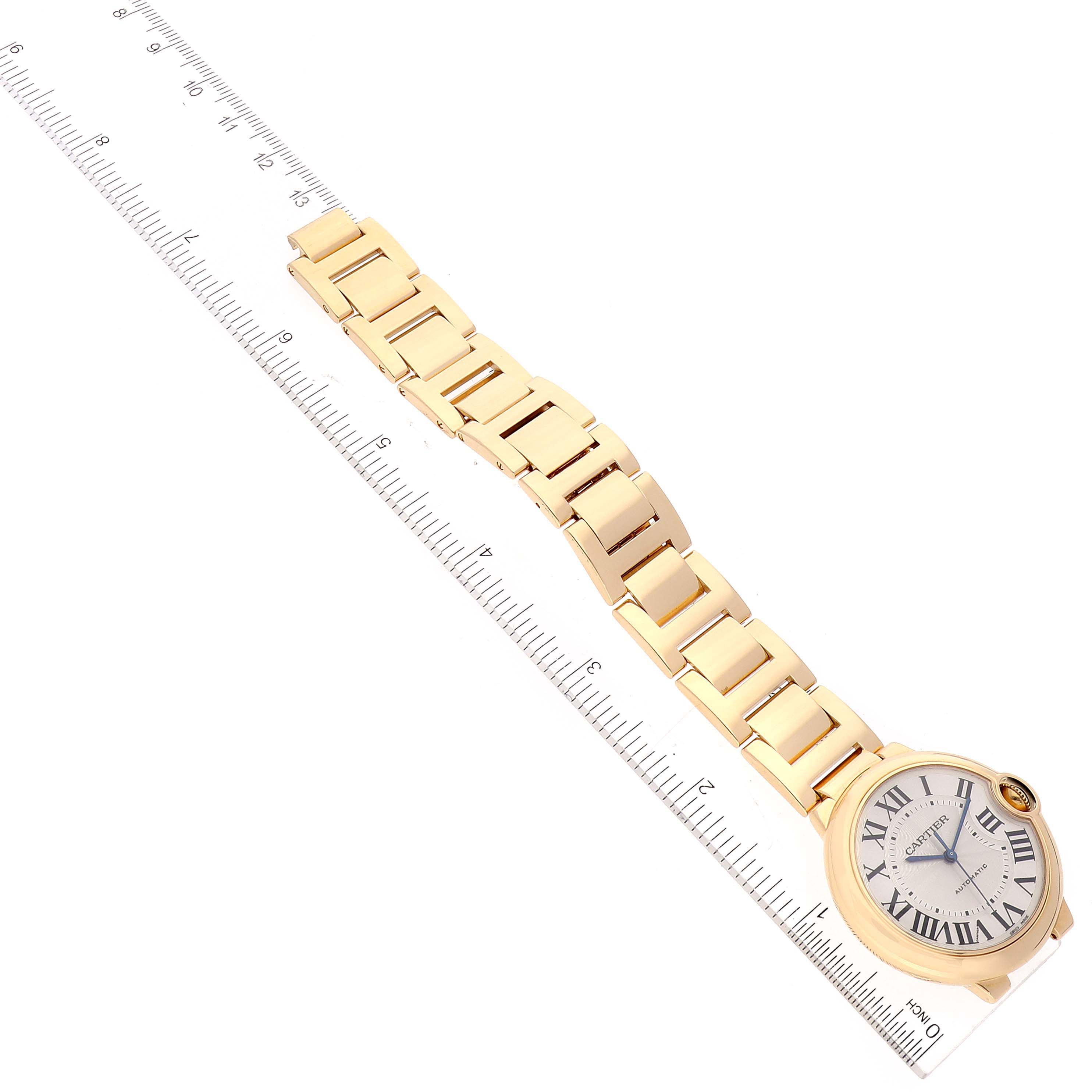 The image shows the Ballon Bleu model by Cartier from an angled top-down view, focusing on the watch face and bracelet.