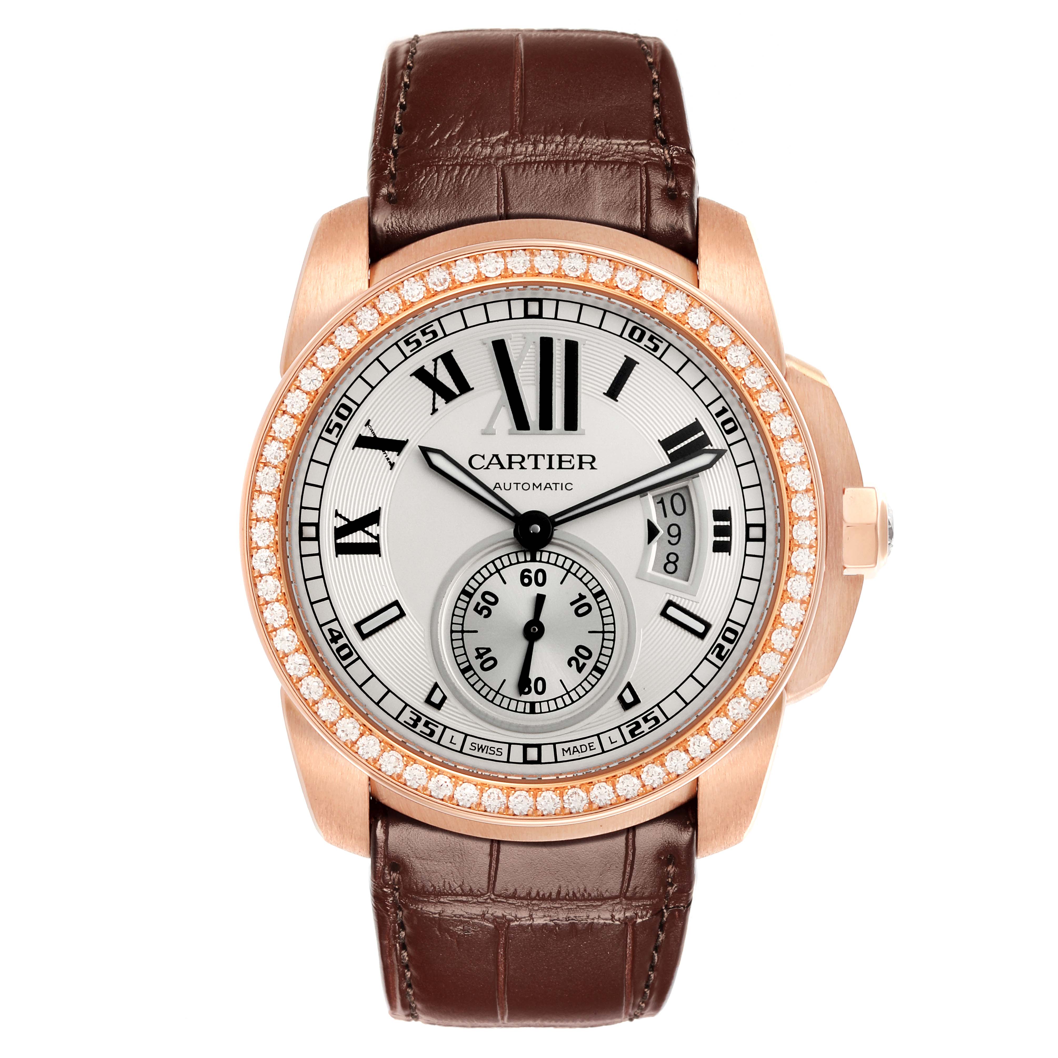 The Calibre de Cartier watch is shown from a front angle, displaying the dial, bezel, and leather strap.