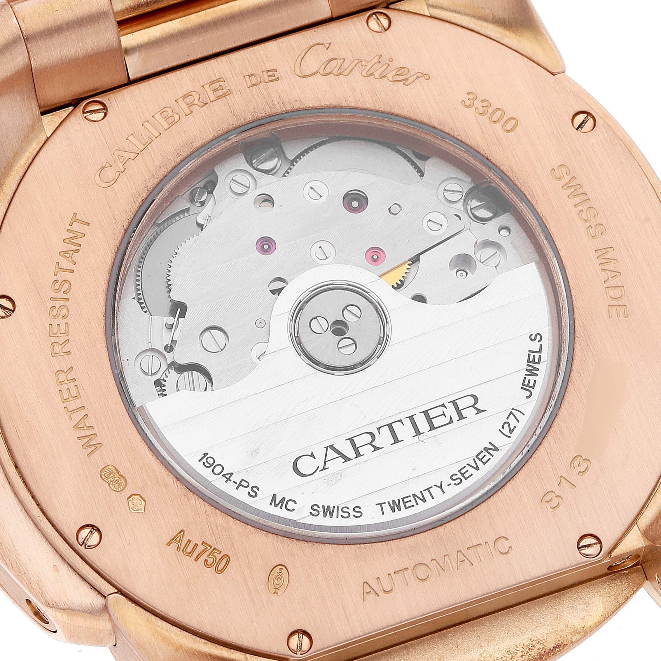 This image shows the back view of a Calibre de Cartier watch by Cartier, revealing the movement and engravings.