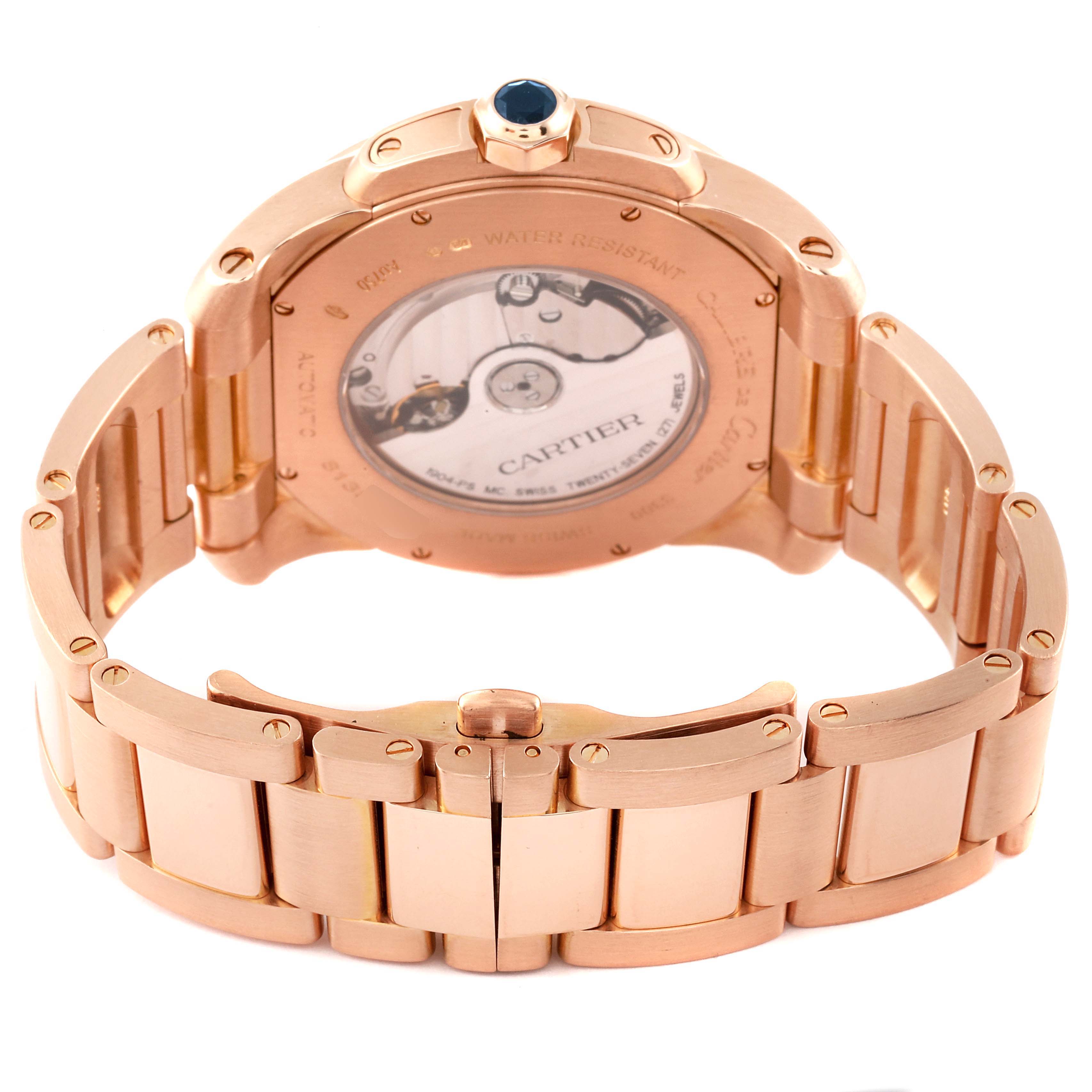 The image shows the back view of a rose gold Calibre de Cartier watch by Cartier, focusing on the case back and part of the bracelet.