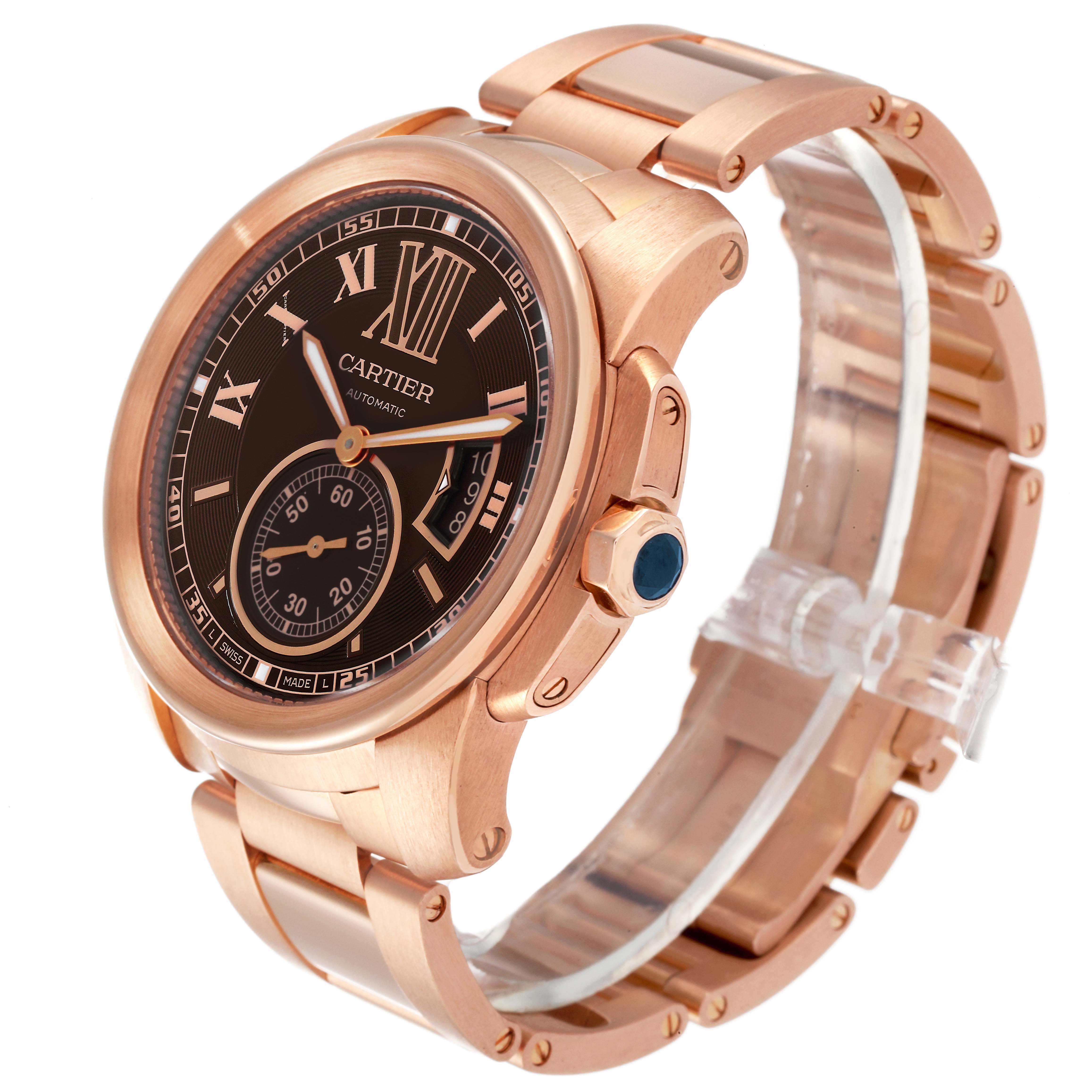 The Calibre de Cartier watch by Cartier is shown at a slight angle, displaying its face, bezel, crown, and bracelet.