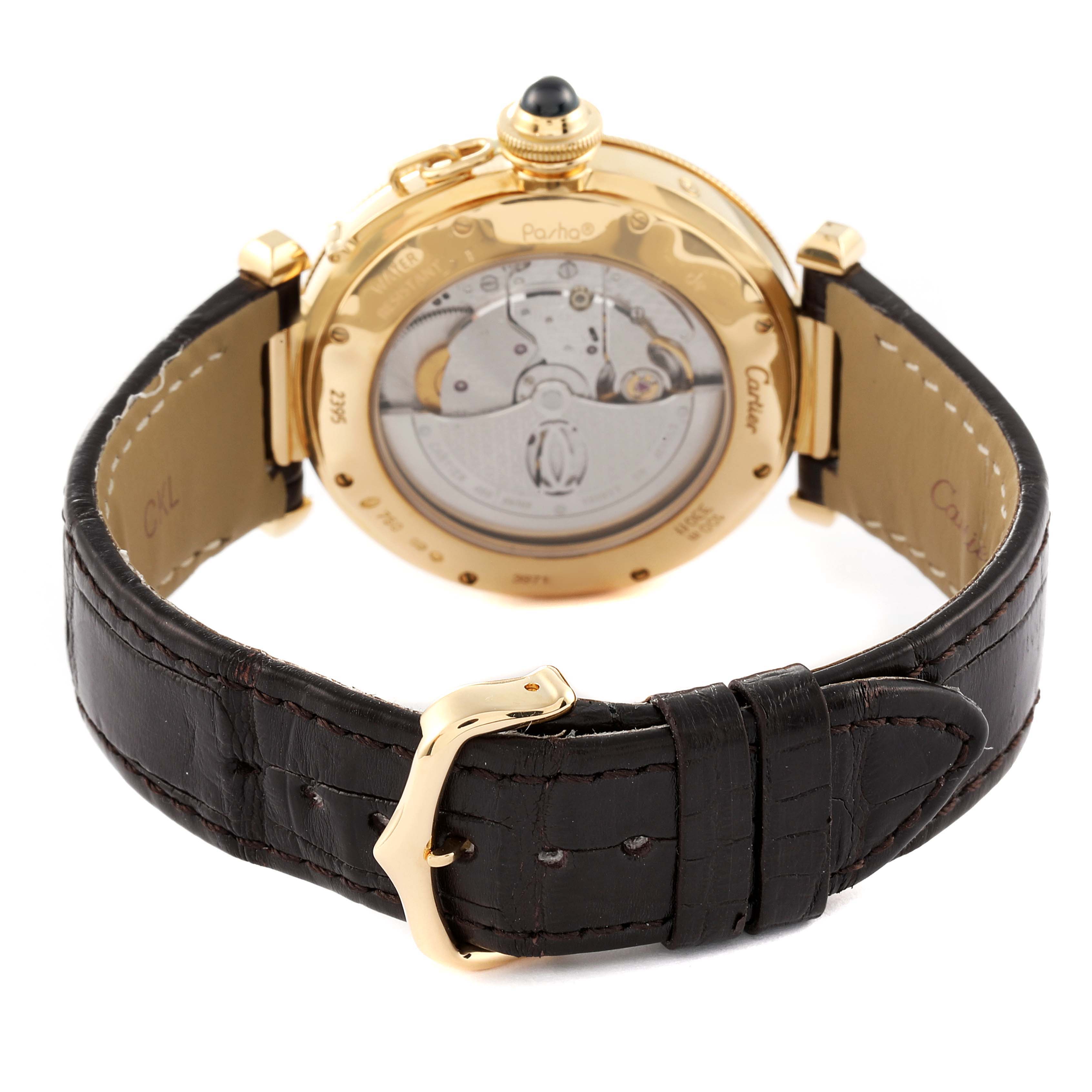 The image shows the back view of a Cartier Pasha W30144D1 Men's Yellow Gold Silver Dial W30144D1 Men's Yellow Gold Silver Dial watch, highlighting its inner mechanism and leather strap with a gold buckle.