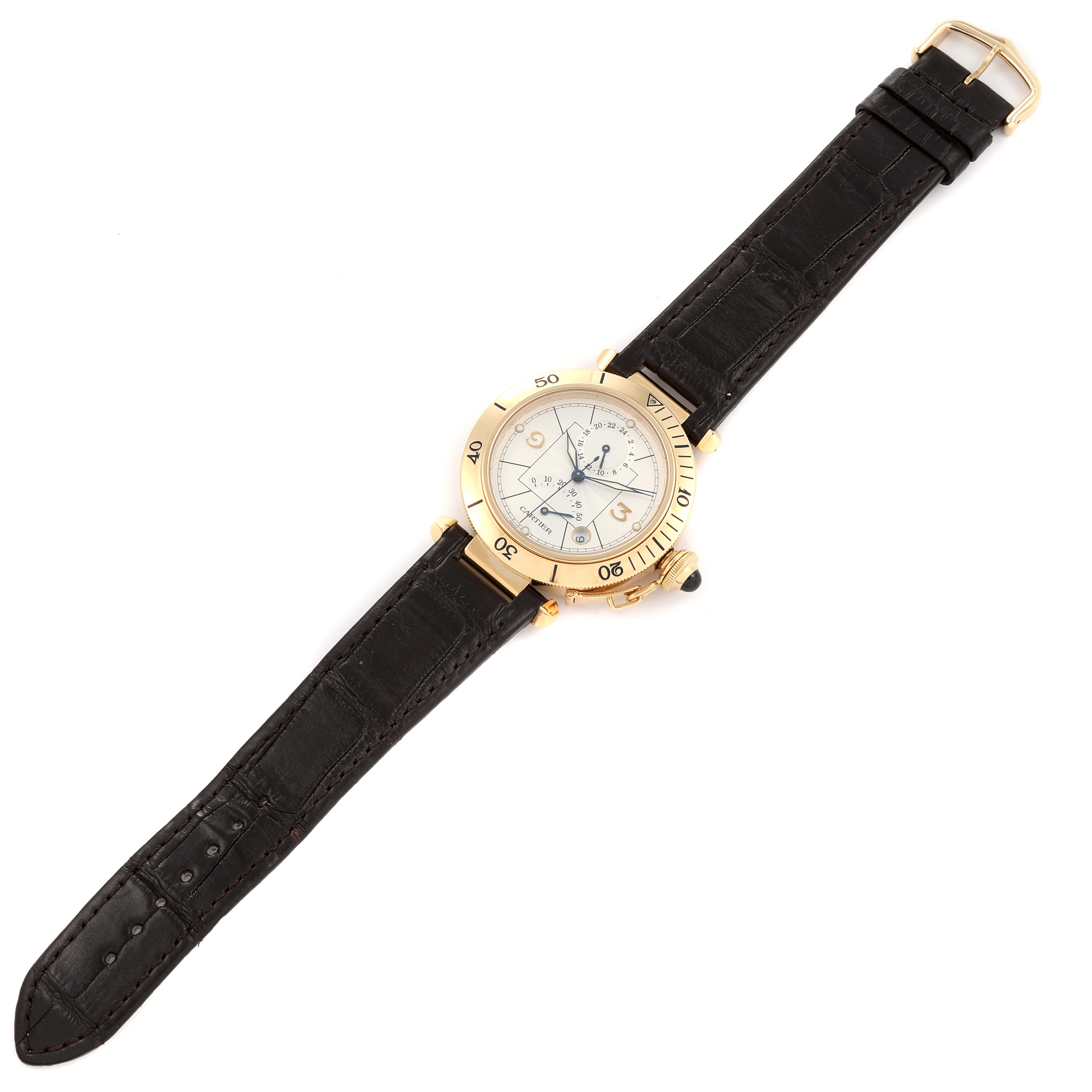 The Cartier Pasha W30144D1 Men's Yellow Gold Silver Dial W30144D1 Men's Yellow Gold Silver Dial watch is shown from an overhead angle, displaying its face, black strap, and gold bezel.