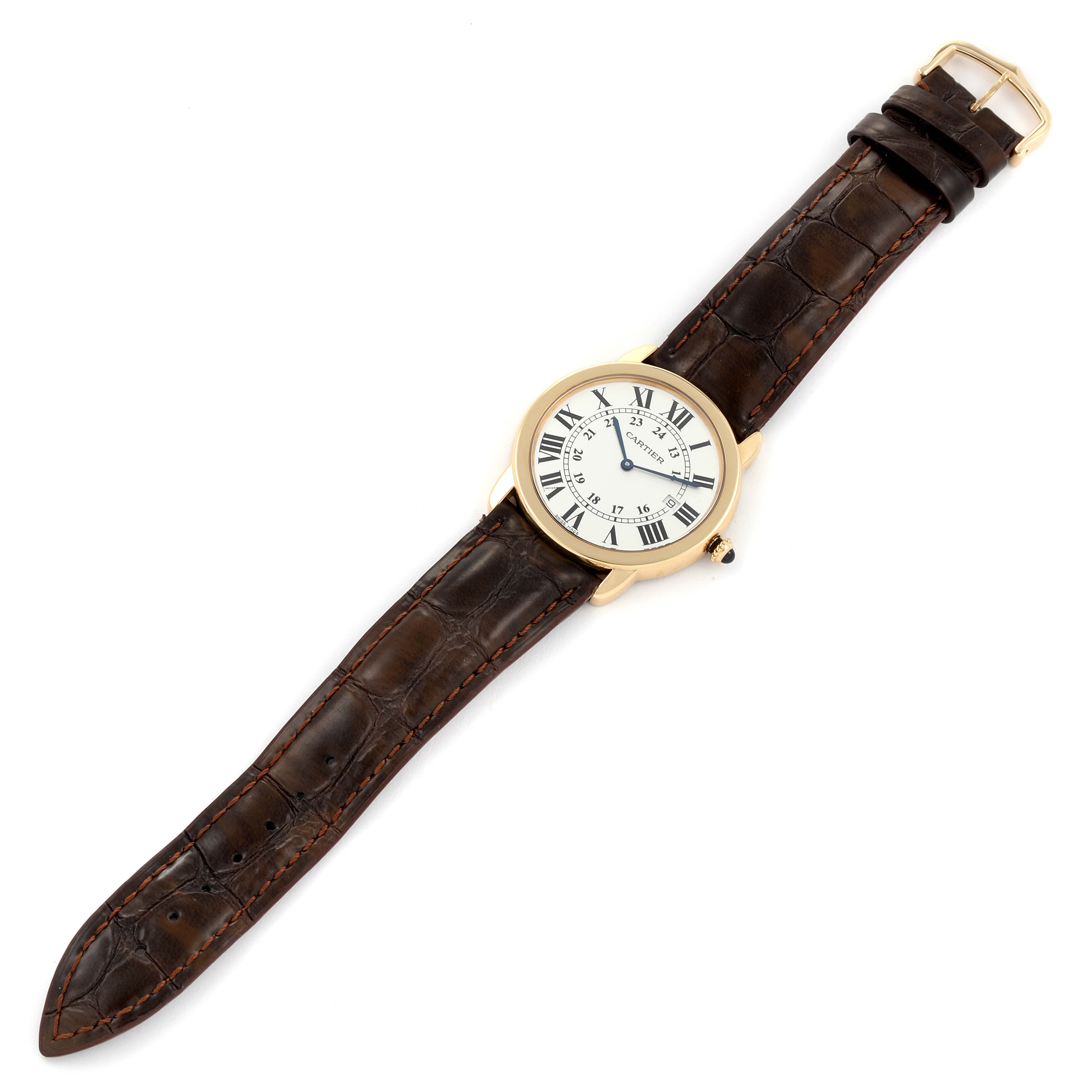 The image shows a top view of a Cartier Ronde W6700455 Men
s Yellow Gold Silver Dial W6700455 Men
s Yellow Gold Silver Dial watch featuring a white dial, gold case, and brown leather strap.