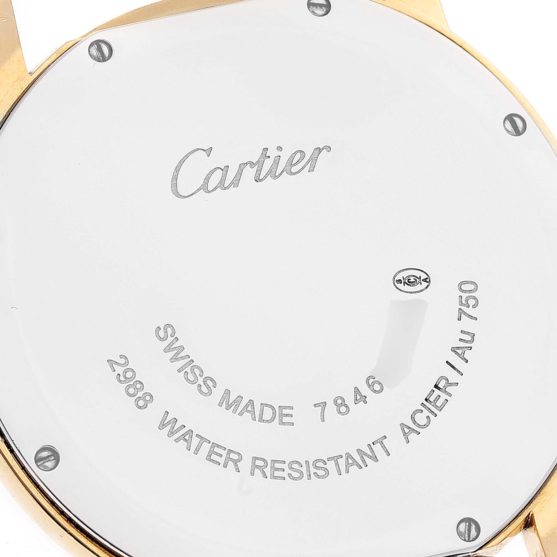This image shows the back case of the Cartier Ronde W6700455 Men
s Yellow Gold Silver Dial W6700455 Men
s Yellow Gold Silver Dial watch, highlighting its inscriptions and screws.