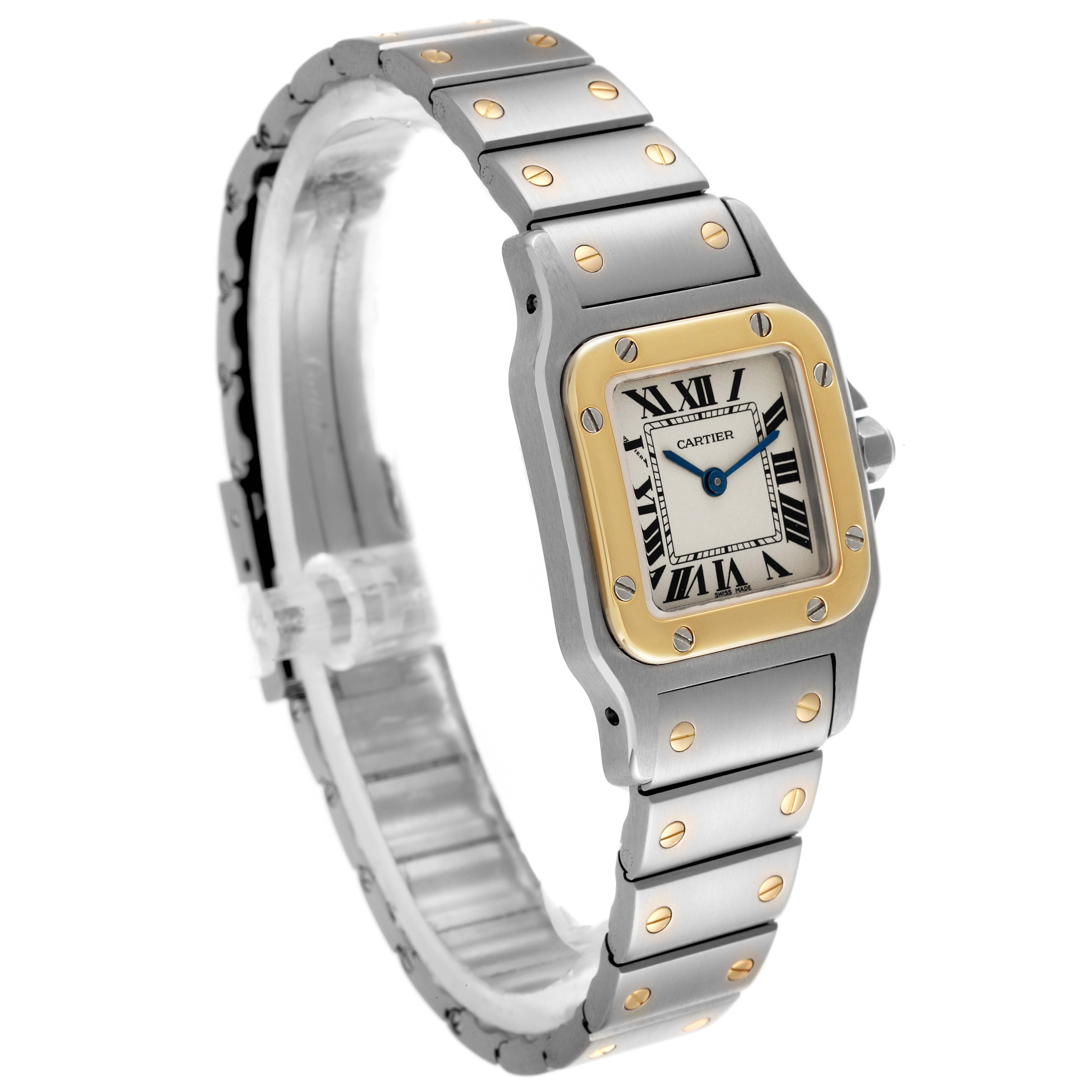 The Cartier Santos W20012C4 Women's Steel and Gold (two tone) Silver Dial W20012C4 Women's Steel and Gold (two tone) Silver Dial watch is shown from a three-quarter angle, highlighting the face, bezel, and part of the bracelet.