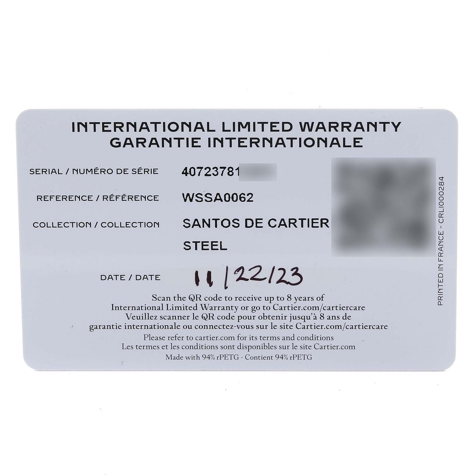 The image shows an international warranty card for the Santos de Cartier watch model.