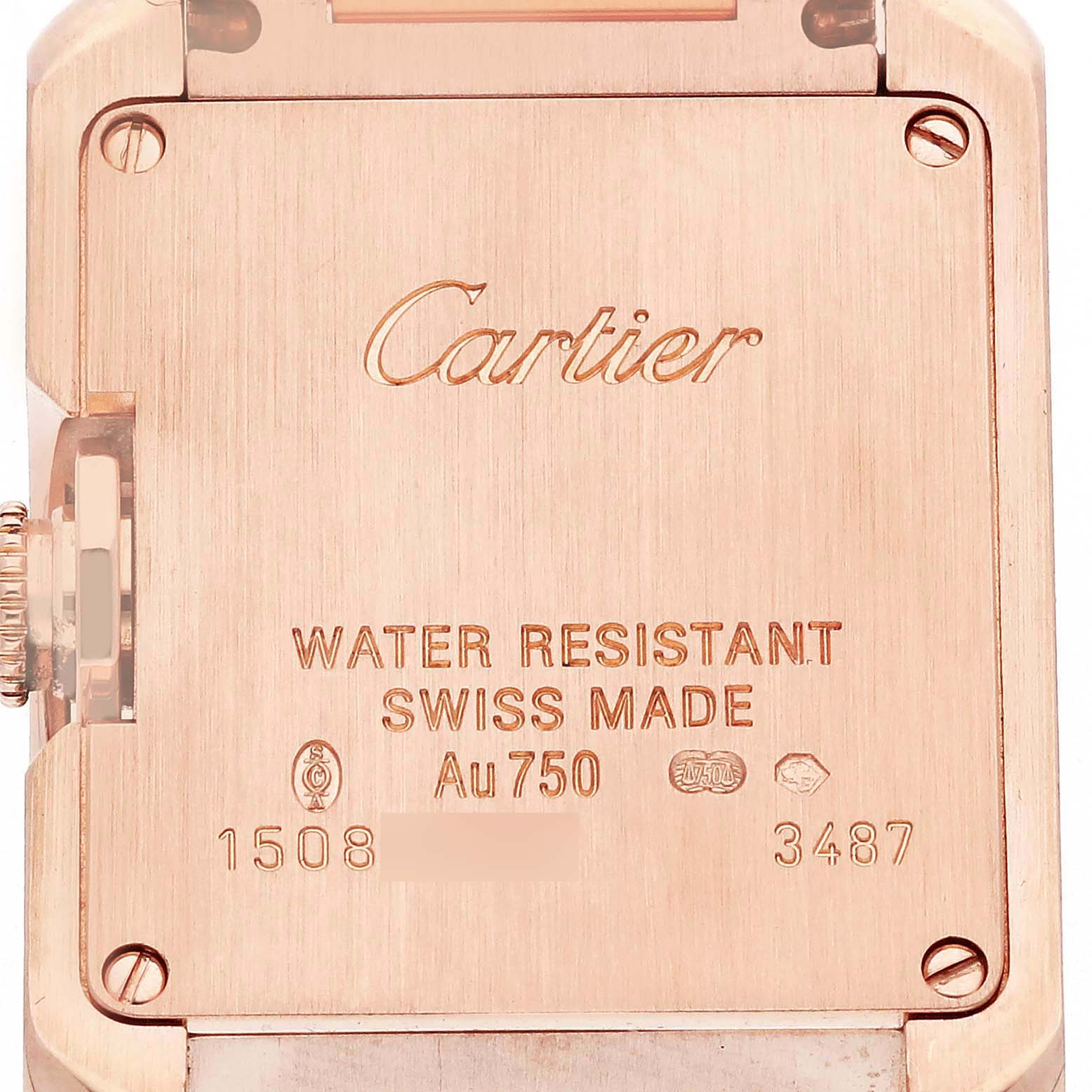 The image shows the back case of a Cartier Tank Anglaise W5310013 Women
s Rose Gold Silver Dial W5310013 Women
s Rose Gold Silver Dial watch, highlighting engraved details and screws.