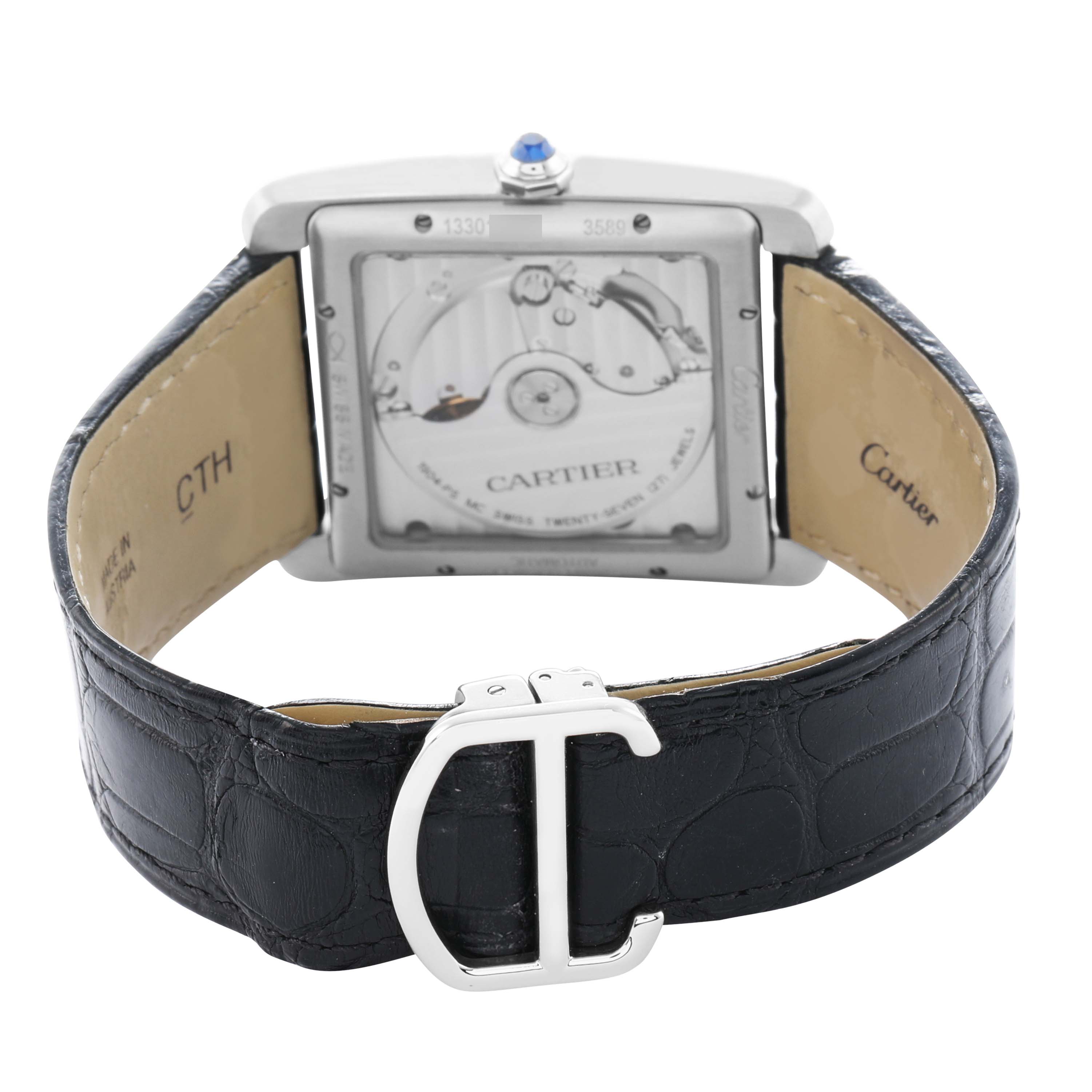 The image shows the back view of the Cartier Tank MC W5330003 Men
s Stainless Steel Silver Dial watch, highlighting its movement and black leather strap with a clasp.