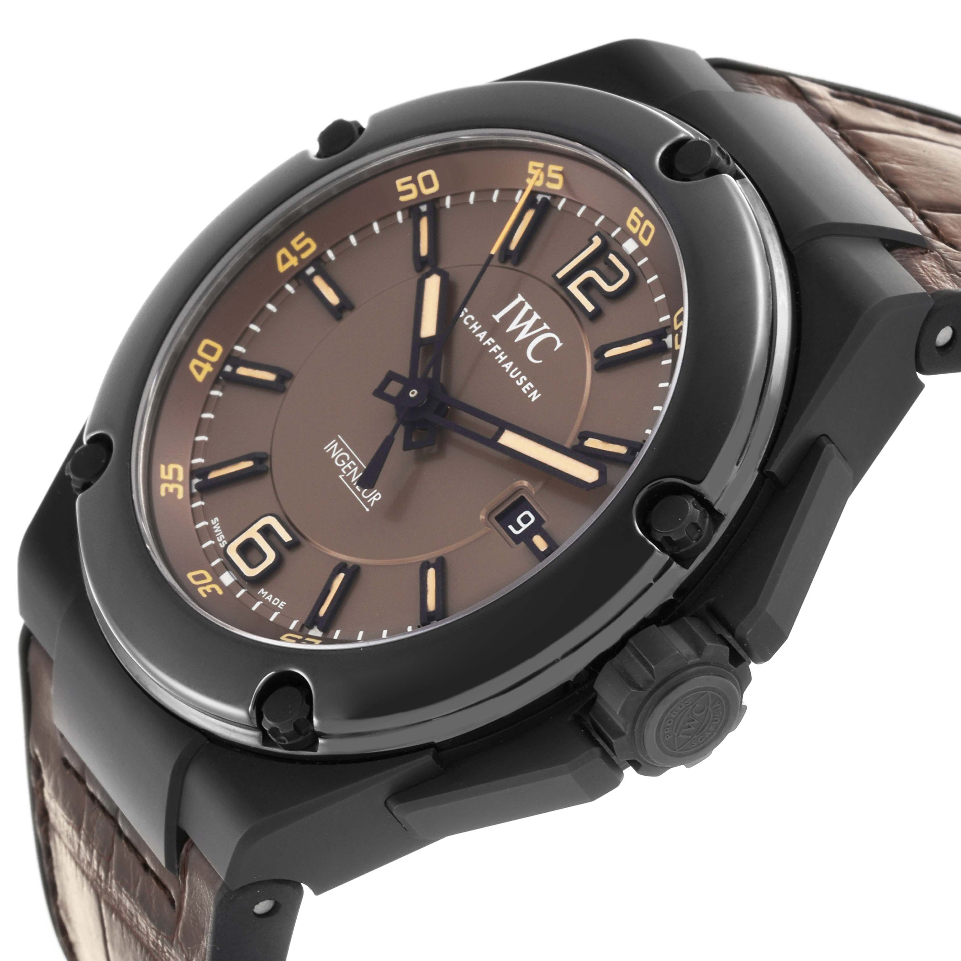 The IWC Ingenieur IW322504 Men's Ceramic Brown Dial IW322504 Men's Ceramic Brown Dial watch is shown at a slight angle, highlighting the watch face, bezel, crown, and partial strap.