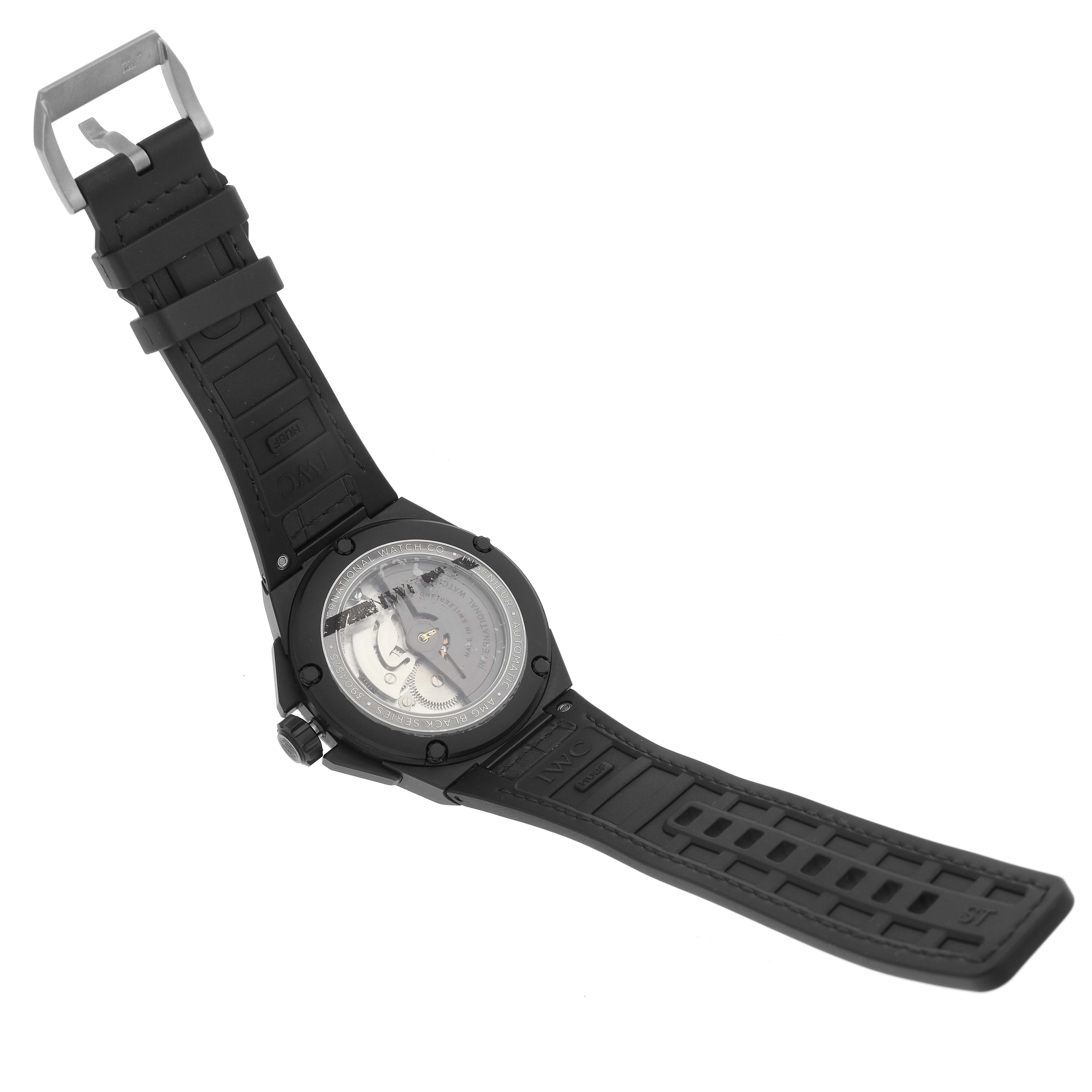 The IWC Ingenieur IW322504 Men's Ceramic Brown Dial IW322504 Men's Ceramic Brown Dial watch is shown from the back, displaying its case back and black strap.