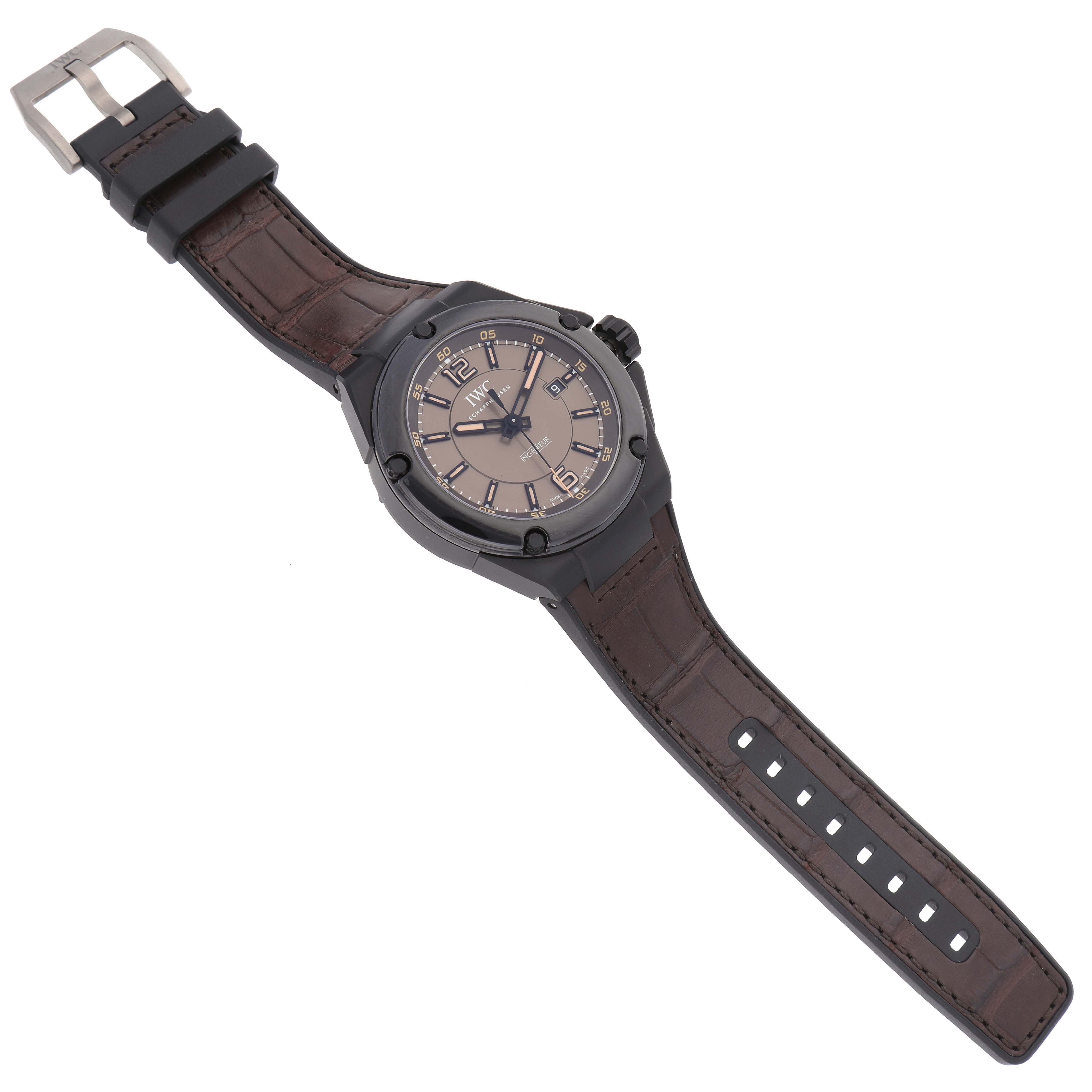 The IWC Ingenieur IW322504 Men's Ceramic Brown Dial IW322504 Men's Ceramic Brown Dial watch is shown from a top-down angle, displaying the face, bezel, strap, and buckle.