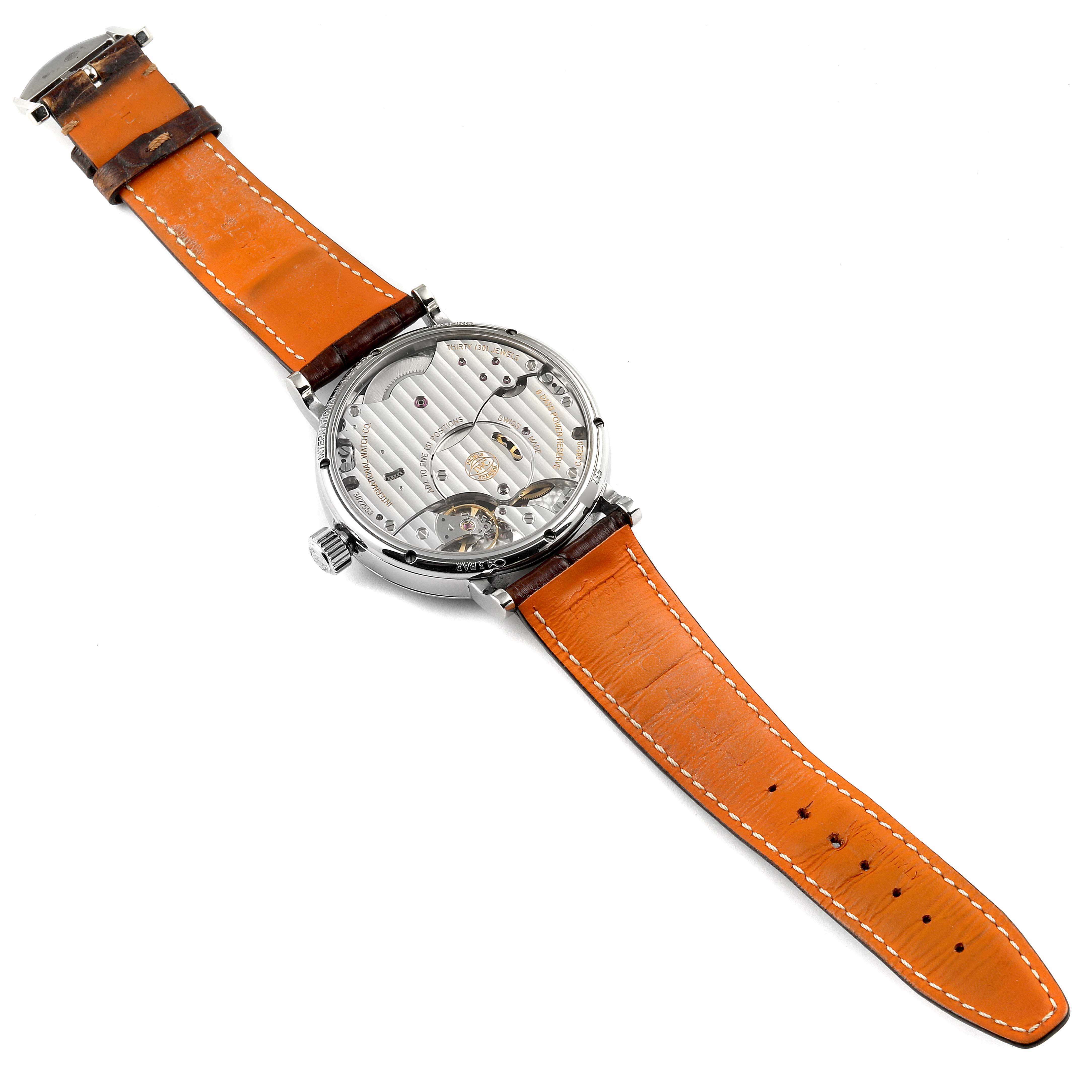 This image shows the back view of an IWC Portofino IW516201 Men's Stainless Steel Silver Dial IW516201 Men's Stainless Steel Silver Dial watch, displaying its movement and orange leather strap.