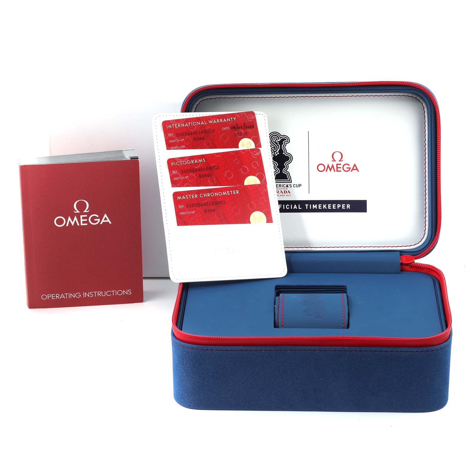 The image shows the packaging and accessories of an Omega Seamaster 210.30.44.51.03.002 Men's Stainless Steel Blue Dial 210.30.44.51.03.002 Men's Stainless Steel Blue Dial watch, including operating instructions, warranty cards, and the watch box.