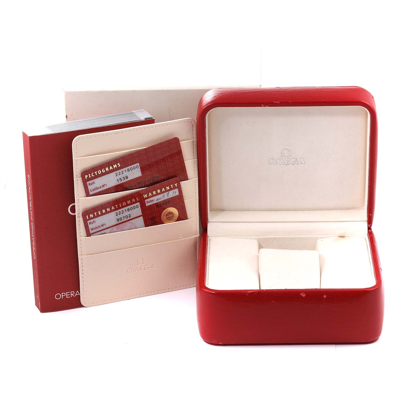 The image shows an Omega Seamaster 2221.80.00 Men's Stainless Steel Blue Dial 2221.80.00 Men's Stainless Steel Blue Dial watch accessories, including an open display box, warranty cards, and a booklet from a front angle.