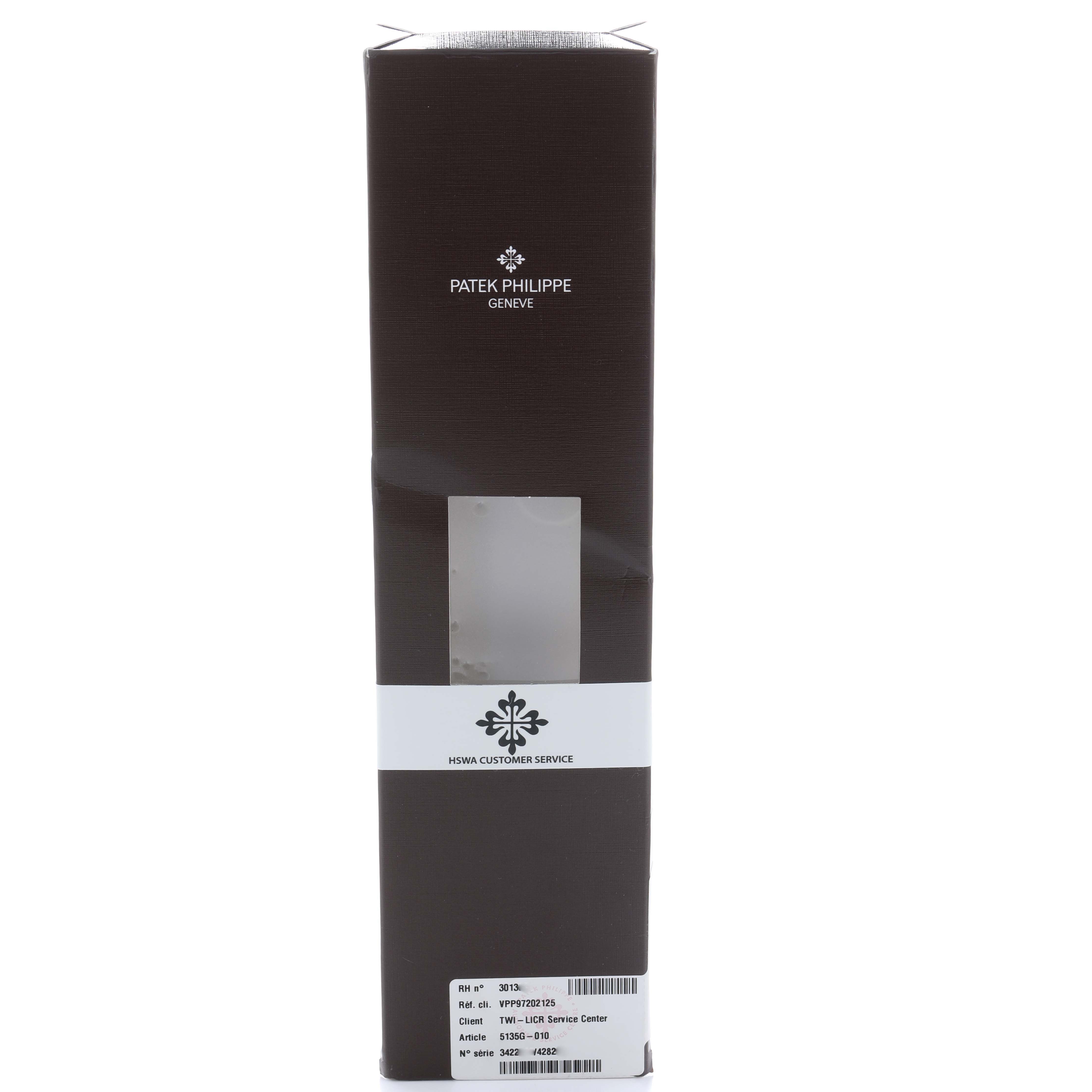 The image shows the packaging box for a Patek Philippe Gondolo 5135G-010 Men
s White Gold Grey Dial watch, viewed from the side with branding visible.