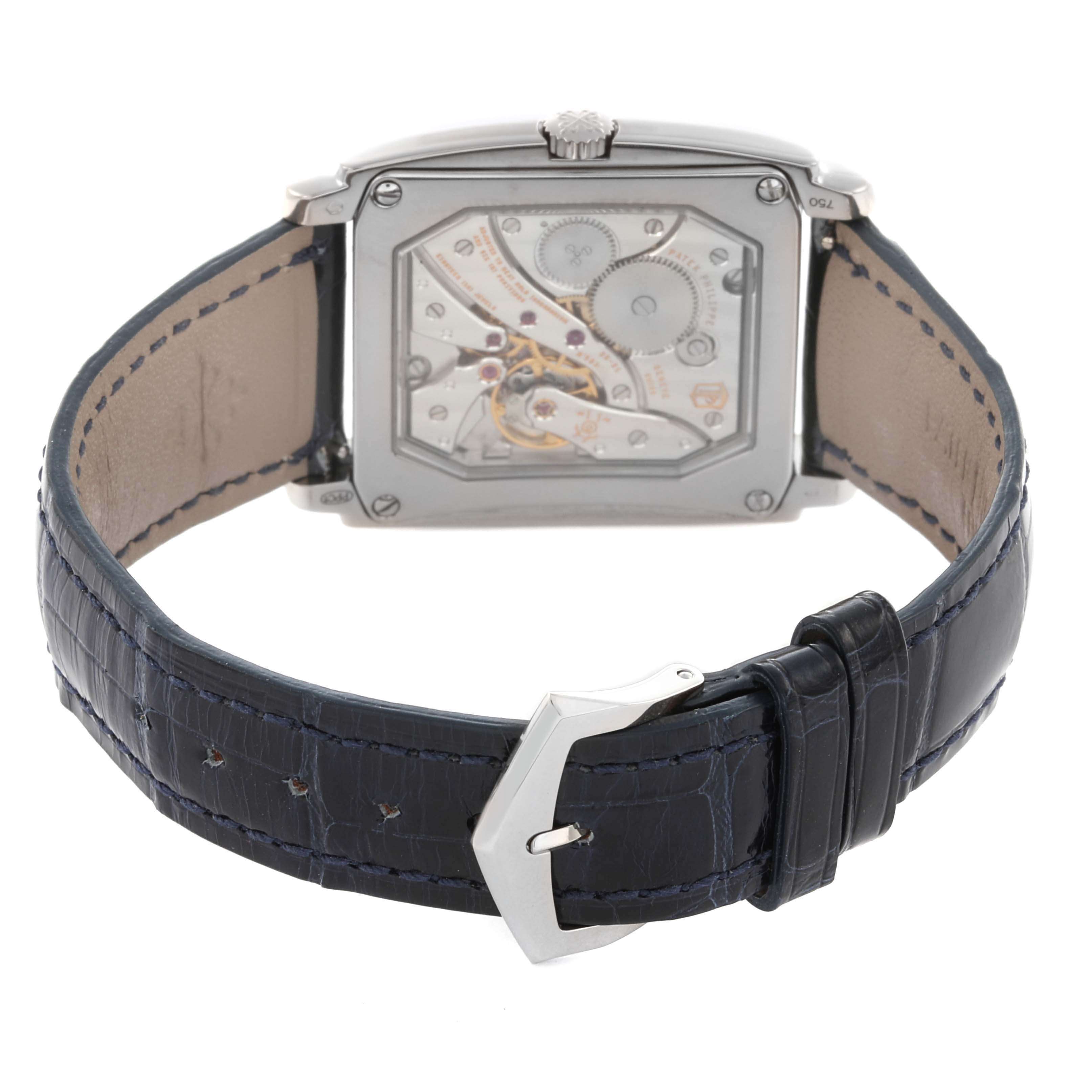 The image shows the back view of the Patek Philippe Gondolo 5124G-011 Men's White Gold Blue Dial 5124G-011 Men's White Gold Blue Dial watch, highlighting its open case back and detailed movement.