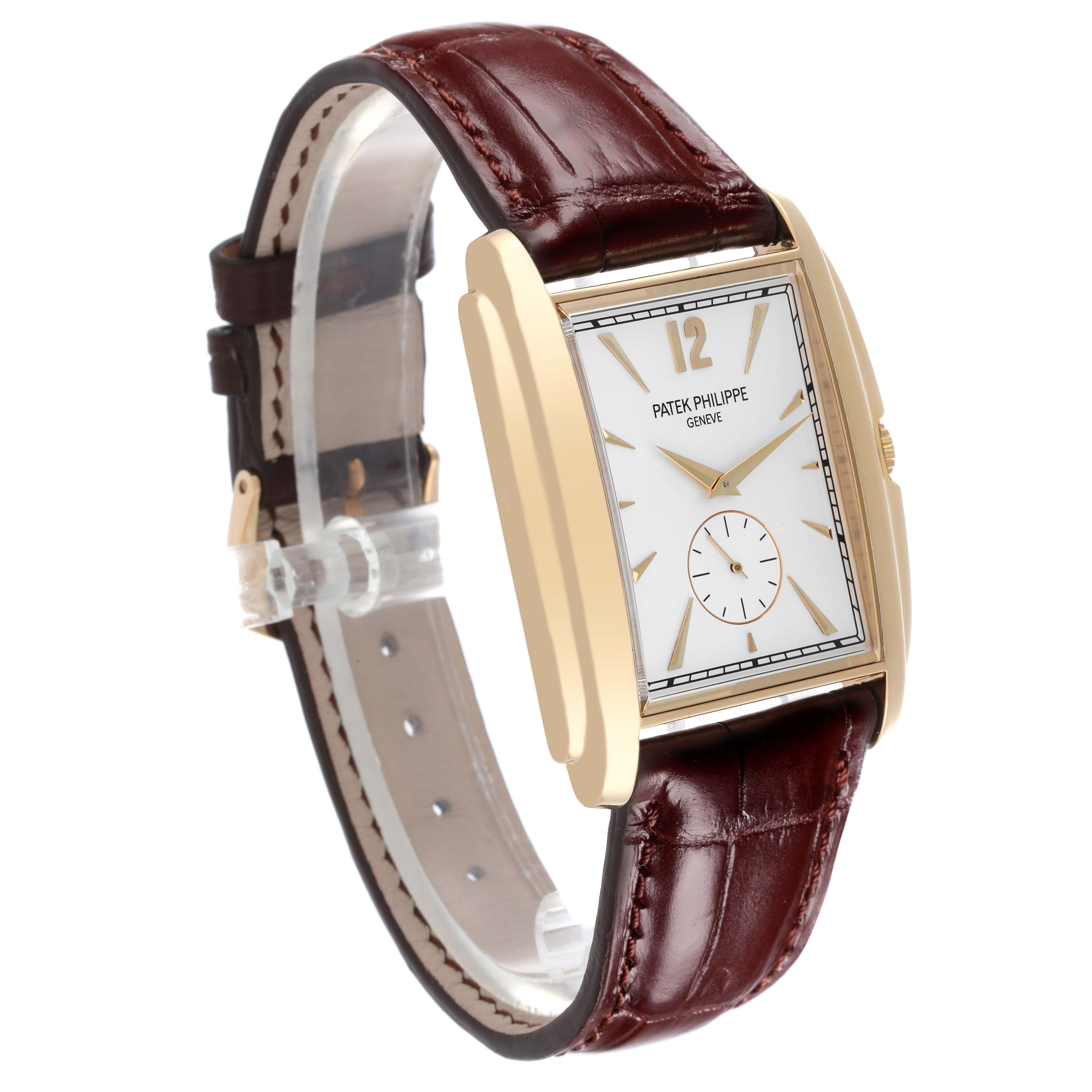 The Patek Philippe Gondolo 5124J Men's Yellow Gold Silver Dial 5124J Men's Yellow Gold Silver Dial watch is shown at a side angle, highlighting the face, gold case, and brown leather strap.