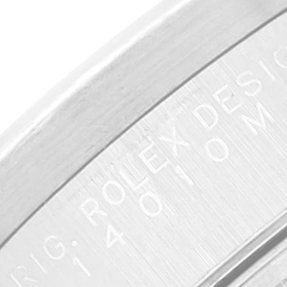 The image shows a close-up of the side of a Rolex Air-King 14010 Men's Stainless Steel White Dial 14010 Men's Stainless Steel White Dial watch, capturing part of the engraved text.