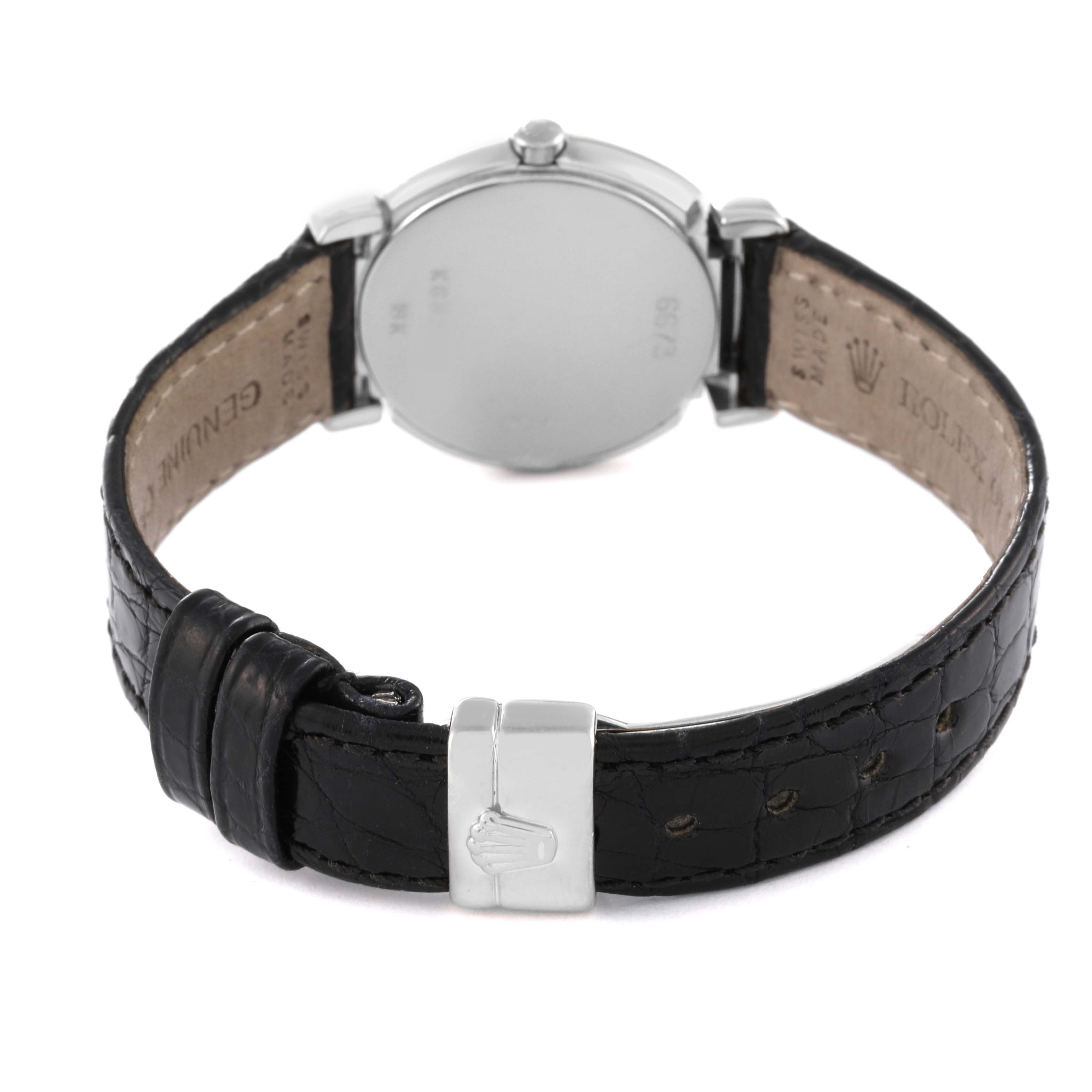 The image shows the back of a Rolex Cellini 6673 Women's White Gold Silver Dial 6673 Women's White Gold Silver Dial watch, highlighting the leather strap and clasp.