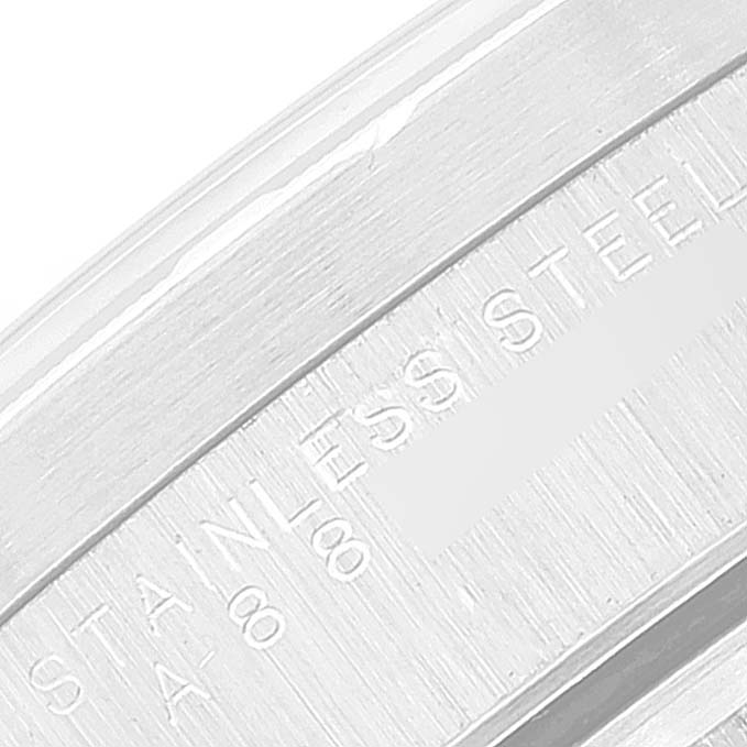 The image shows a close-up of the stainless steel caseback of a Rolex Date 15210 Men
s Stainless Steel Black Dial 15210 Men
s Stainless Steel Black Dial model watch, showcasing the engravings.