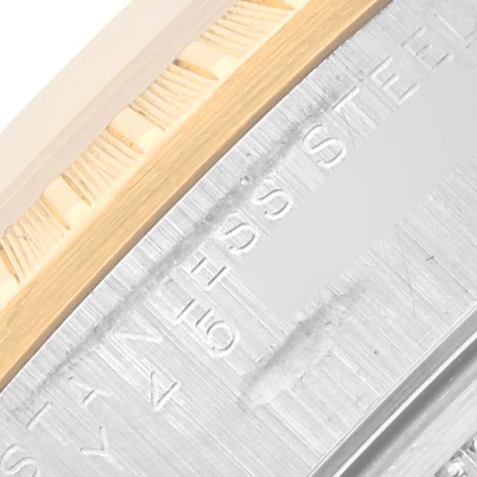 This image shows a close-up angle of the side details and bezel of the Rolex Date 15223 Men's Steel and Gold (two tone) White Dial 15223 Men's Steel and Gold (two tone) White Dial model watch.