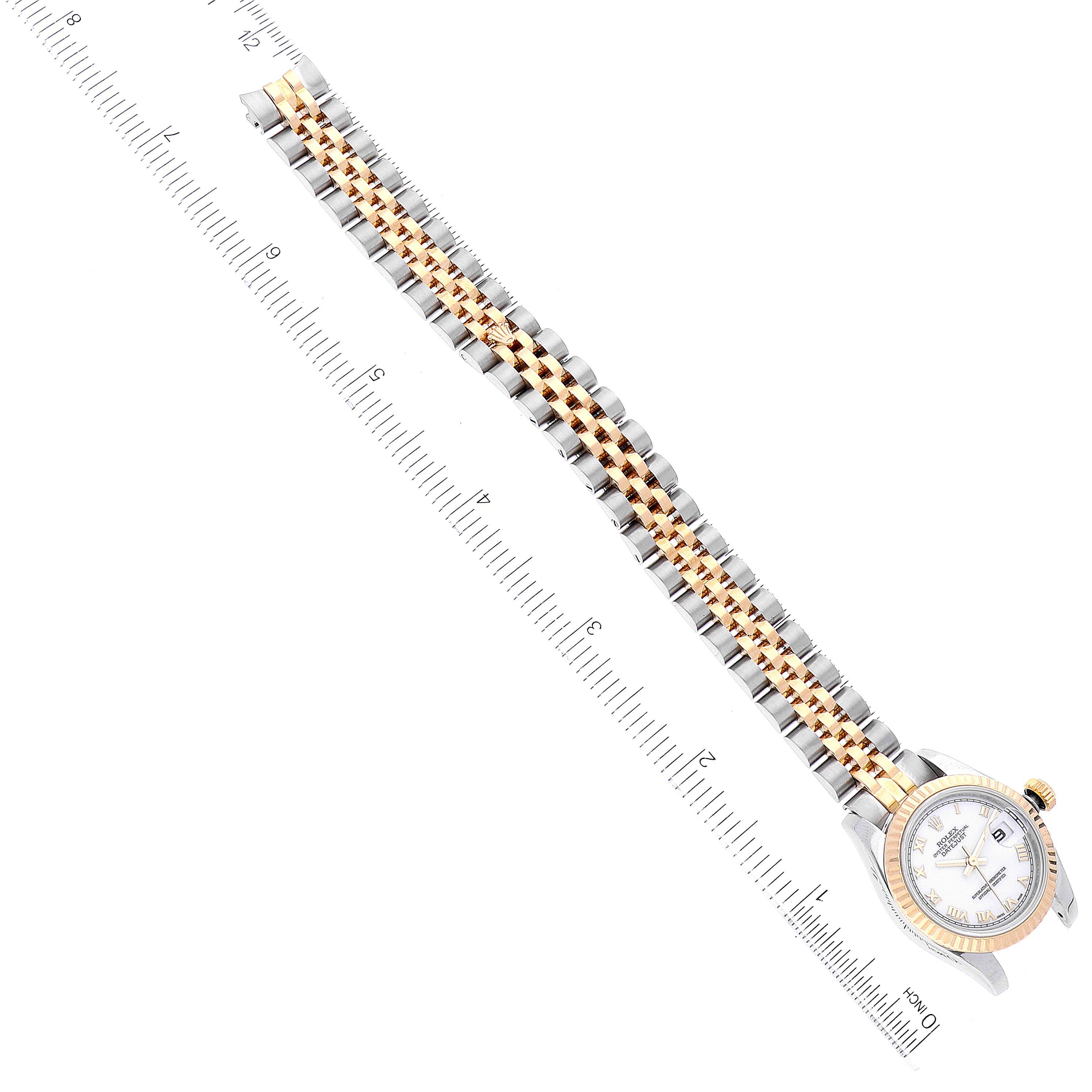 The image shows a Rolex Datejust 179173 Women's Steel and Gold (two tone) White Dial 179173 Women's Steel and Gold (two tone) White Dial watch diagonally with a ruler beside it, highlighting the band and part of the case.