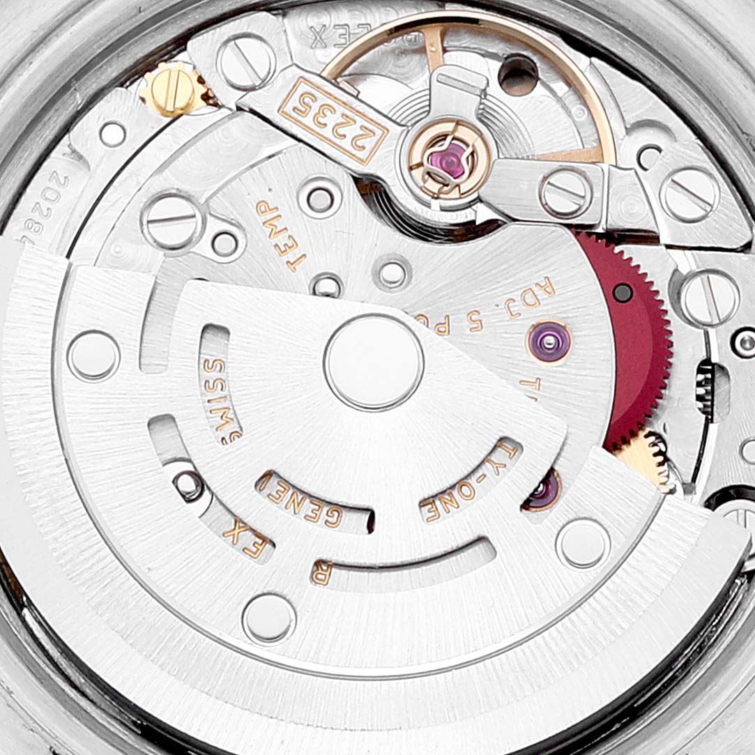 The image shows a close-up view of the movement mechanism of a Rolex Datejust 179173 Women's Steel and Gold (two tone) White Dial 179173 Women's Steel and Gold (two tone) White Dial watch.