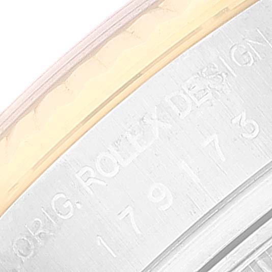 The image shows a close-up view of the side of the bezel and the engraved model number of a Rolex Datejust 179173 Women's Steel and Gold (two tone) White Dial 179173 Women's Steel and Gold (two tone) White Dial watch.
