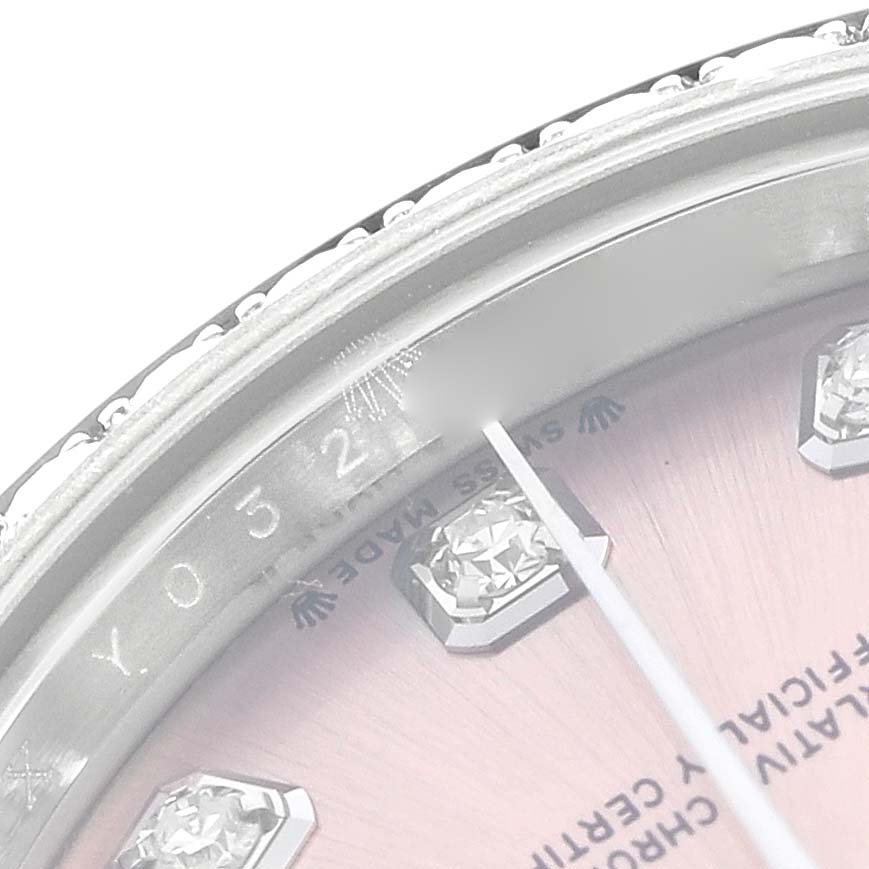 The image shows a close-up of the dial and rehaut of a Rolex Datejust 279384 Women
s Stainless Steel Pink Dial watch, highlighting the diamond markers and inscriptions.