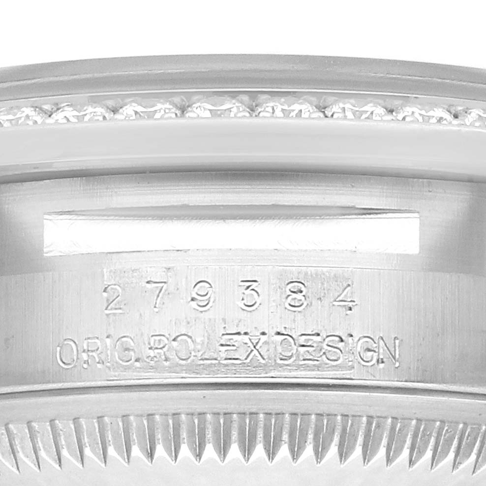 The image shows a close-up of the side of a Rolex Datejust 279384 Women
s Stainless Steel Pink Dial, displaying its model number and part of the bezel.