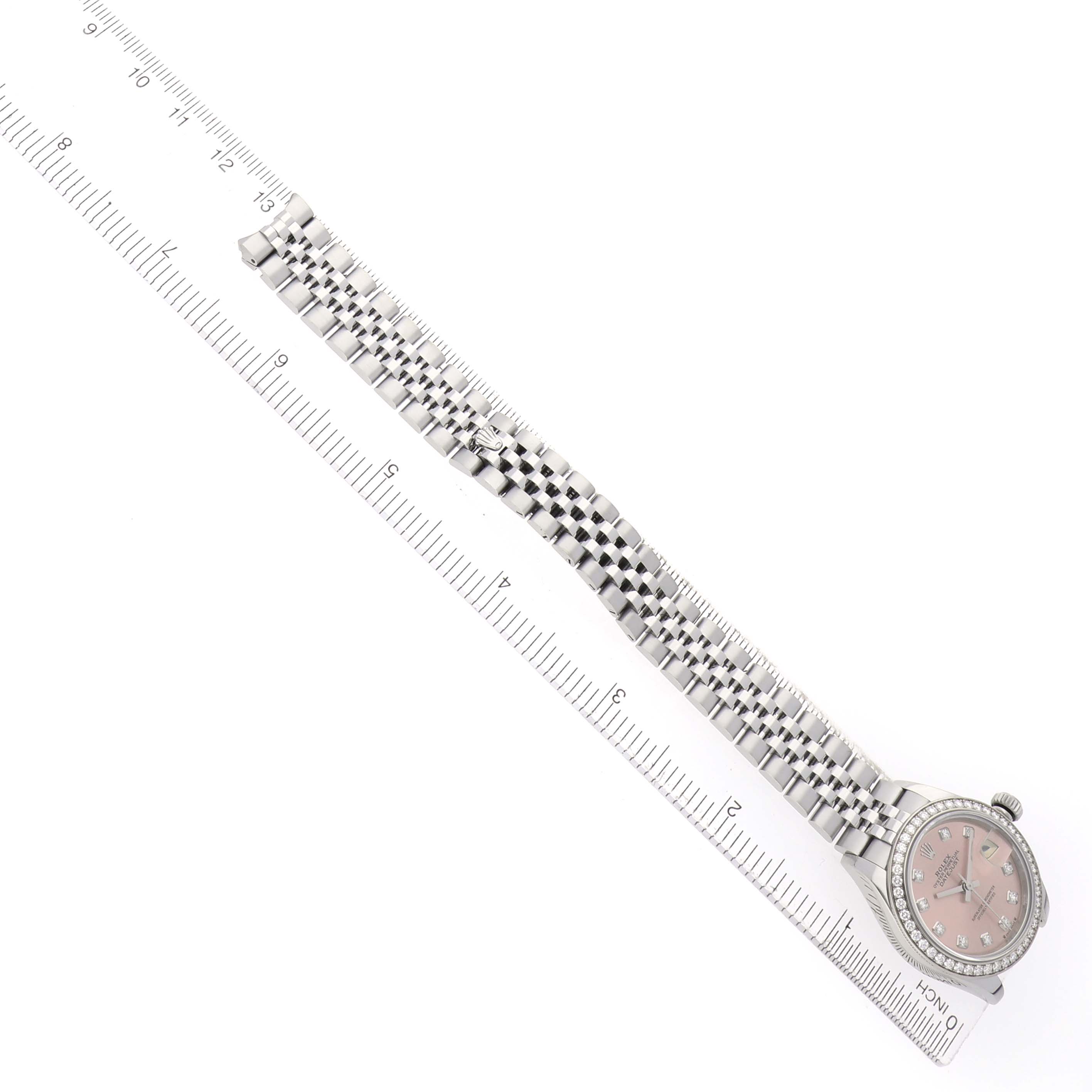 The Rolex Datejust 279384 Women
s Stainless Steel Pink Dial watch is shown from an overhead angle, displaying the dial, bezel, and full bracelet.