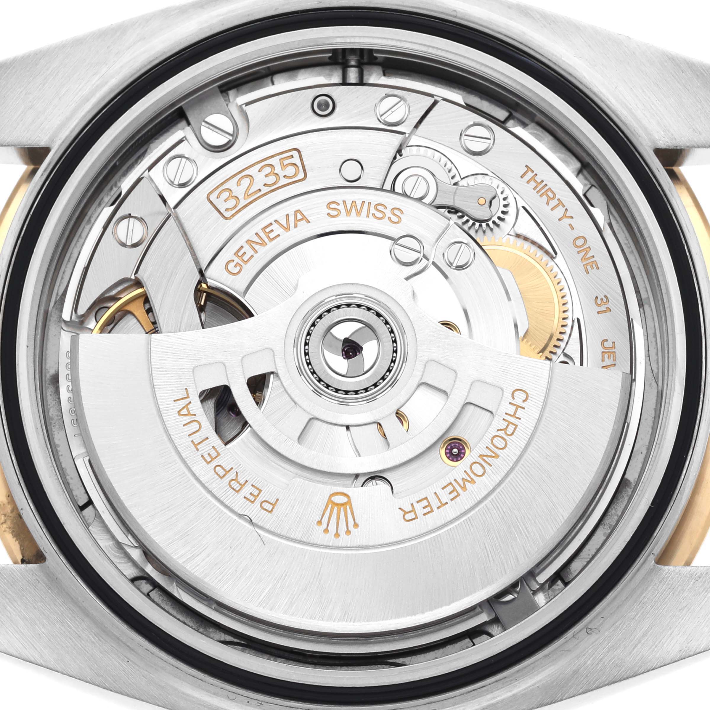 The image shows the movement of a Rolex Datejust 41 126303 Men's Steel and Gold (two tone) Grey Dial 126303 Men's Steel and Gold (two tone) Grey Dial, viewed from the back or underside.